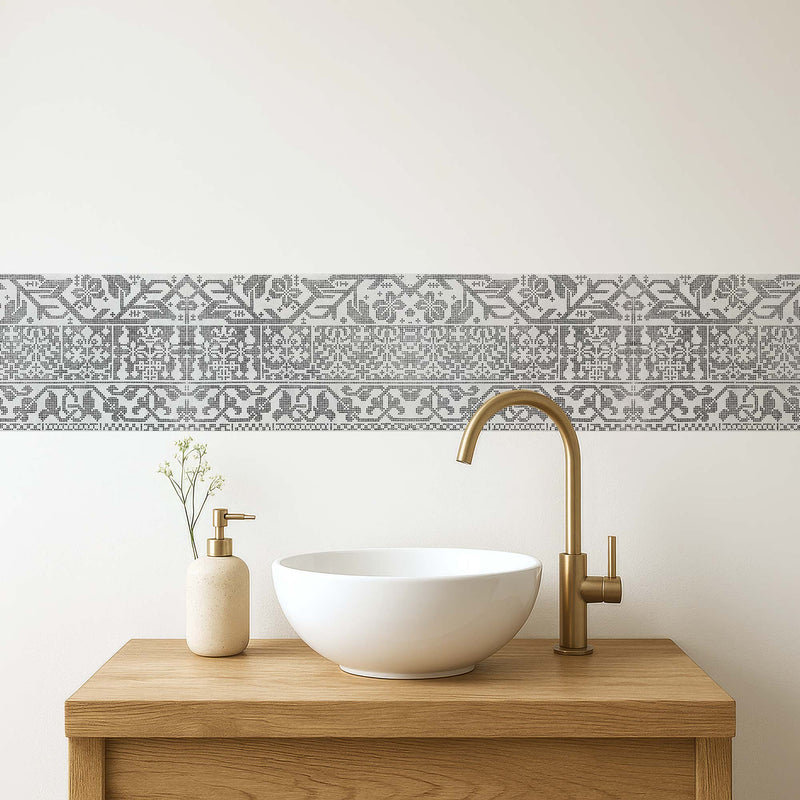 Italian lacework peel and stick wall border in light gray — transitional bathroom vanity with modern white vessel sink and brass fixtures by Decorvm