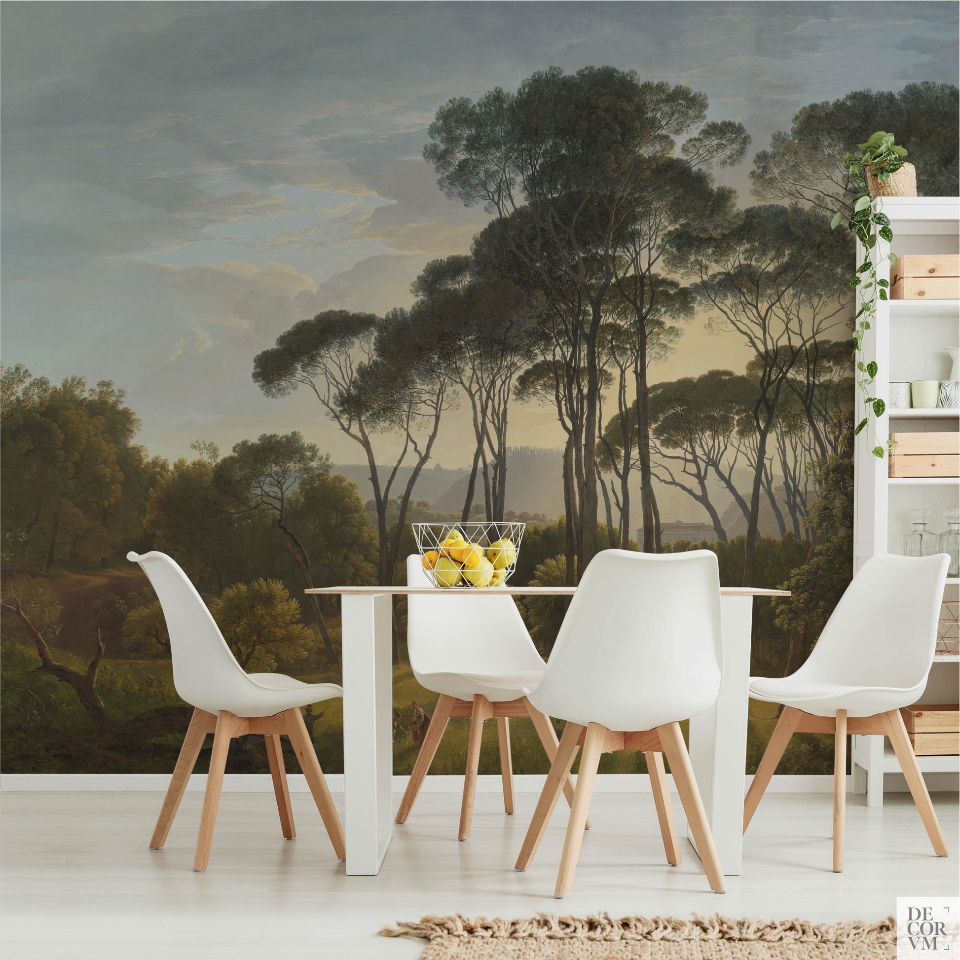 Italian landscape wallpaper mural with umbrella pines behind a modern white dining table and chairs in a bright kitchen area.