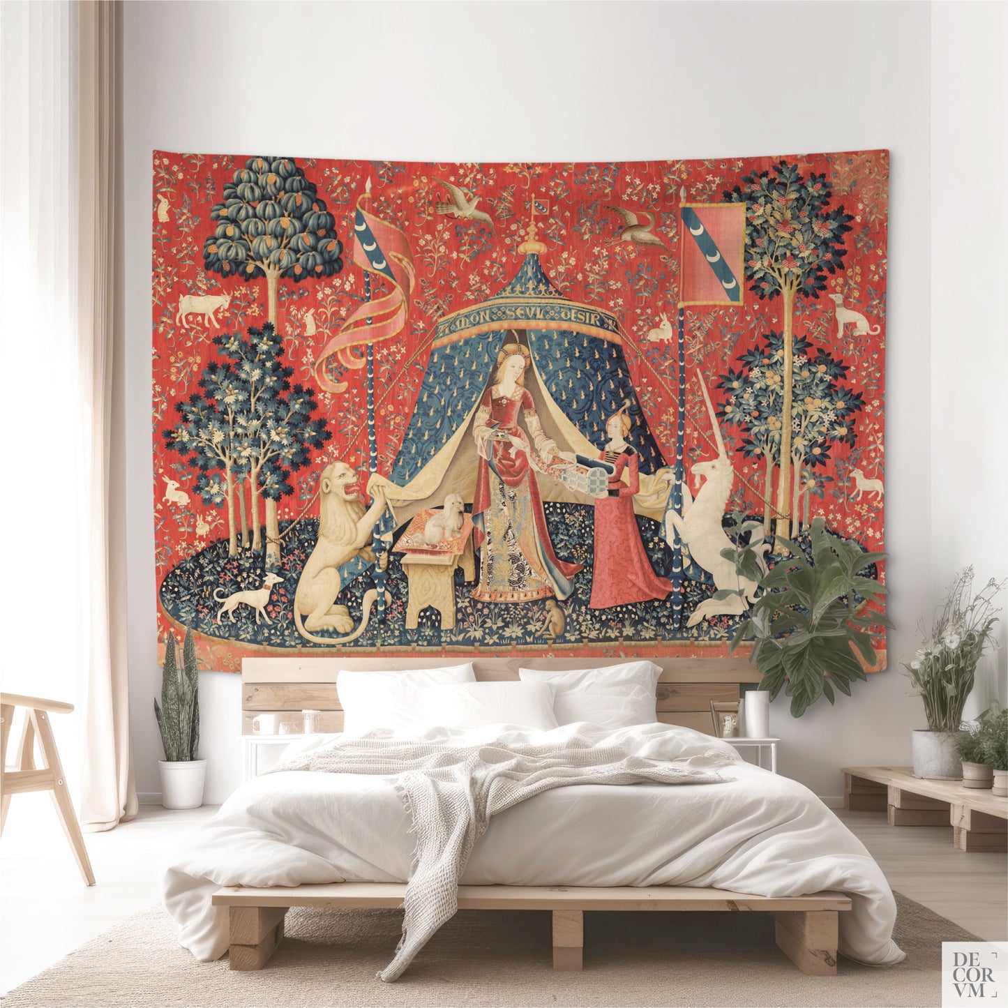 Large Lady and the Unicorn tapestry as a bold historic headboard alternative over a wooden platform bed in a minimalist bedroom.