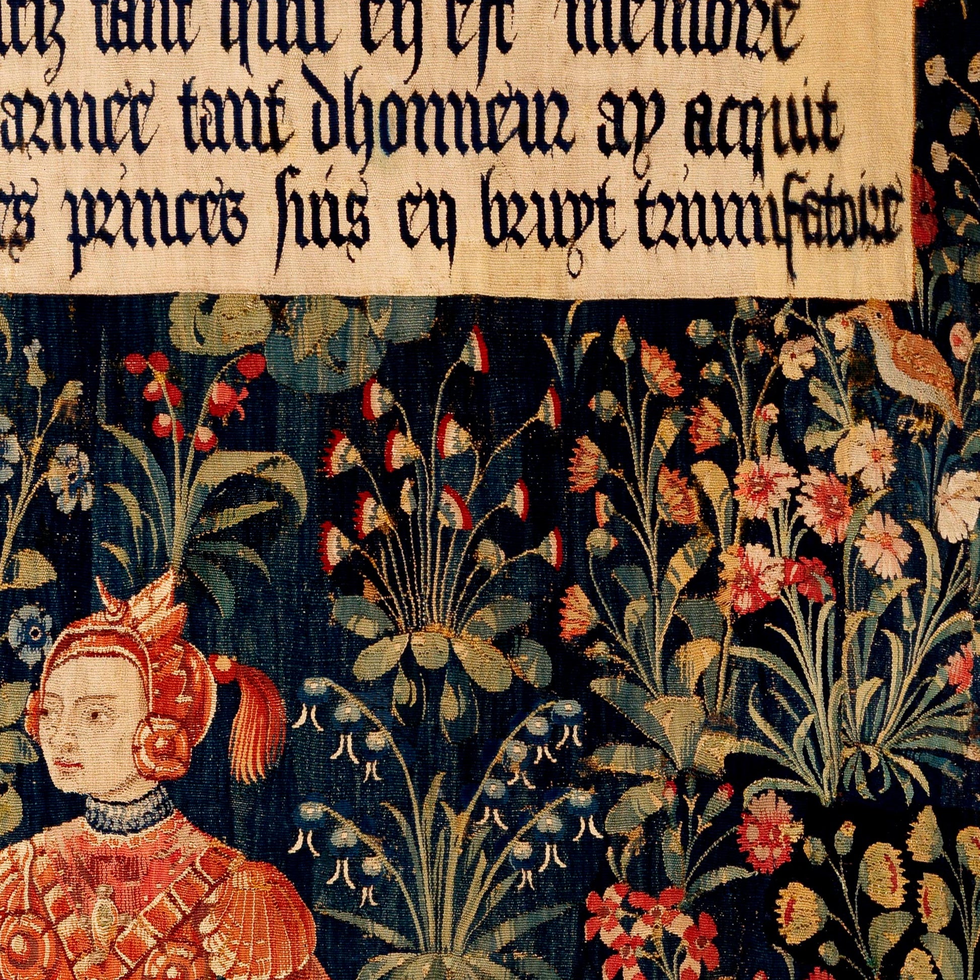 Songbirds and dense botanical foliage around Penthesilea in crimson and gold armour — detail of the late 15th-century Flemish millefleurs tapestry.