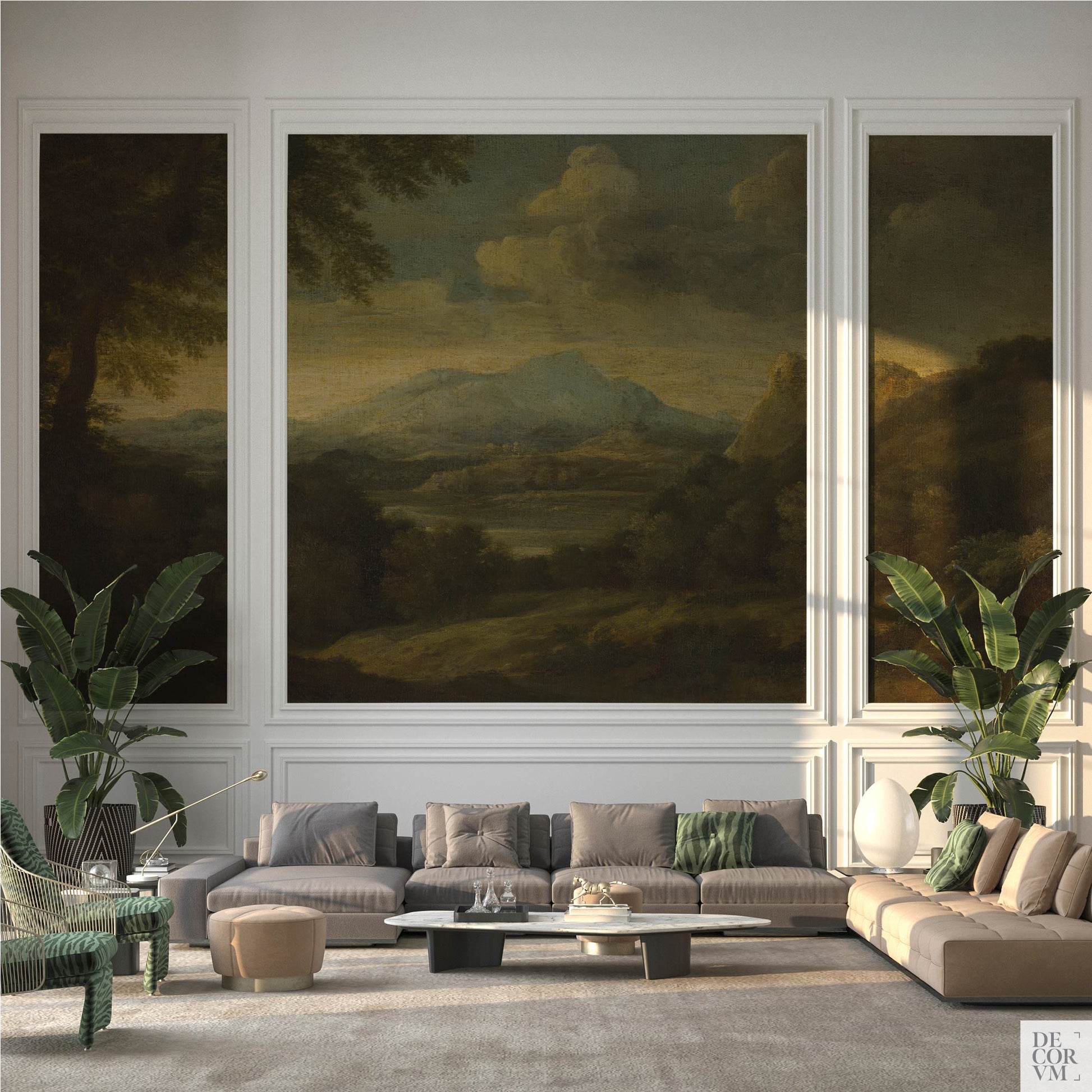 Modern living room displaying the Moody Mountain Landscape Wallpaper Mural — Dark Academia Decor framed within white wall molding panels, positioned behind a modular sofa and two large tropical plants.