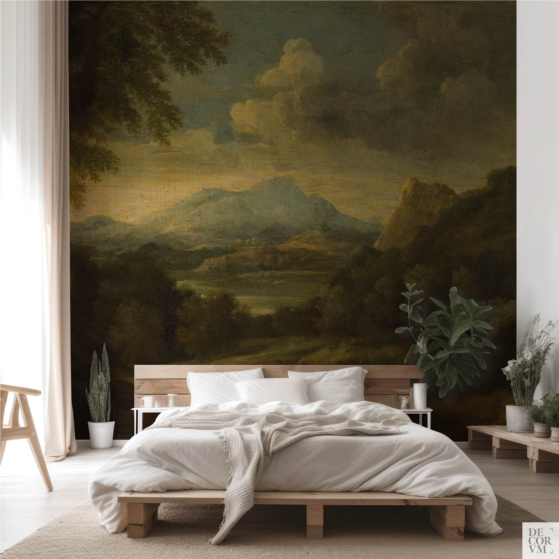 Minimalist bedroom interior showcasing the Moody Mountain Landscape Wallpaper Mural — Dark Academia Decor behind a low wooden bed frame, a wooden side chair, and various potted green plants.