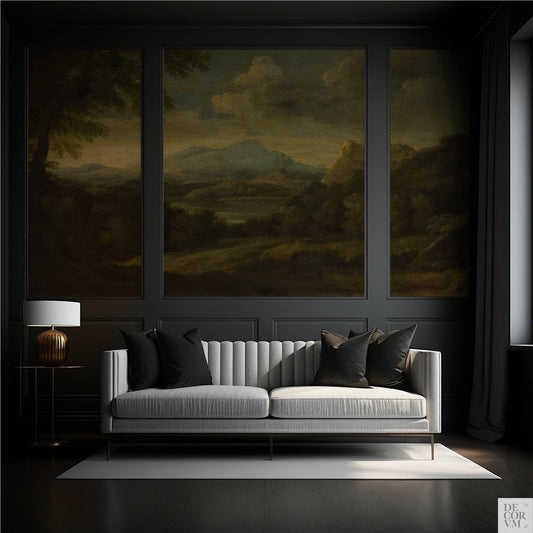 Dark paneled living room wall featuring the Moody Mountain Landscape Wallpaper Mural — Dark Academia Decor, serving as a backdrop for a light grey tufted sofa and a modern golden table lamp.