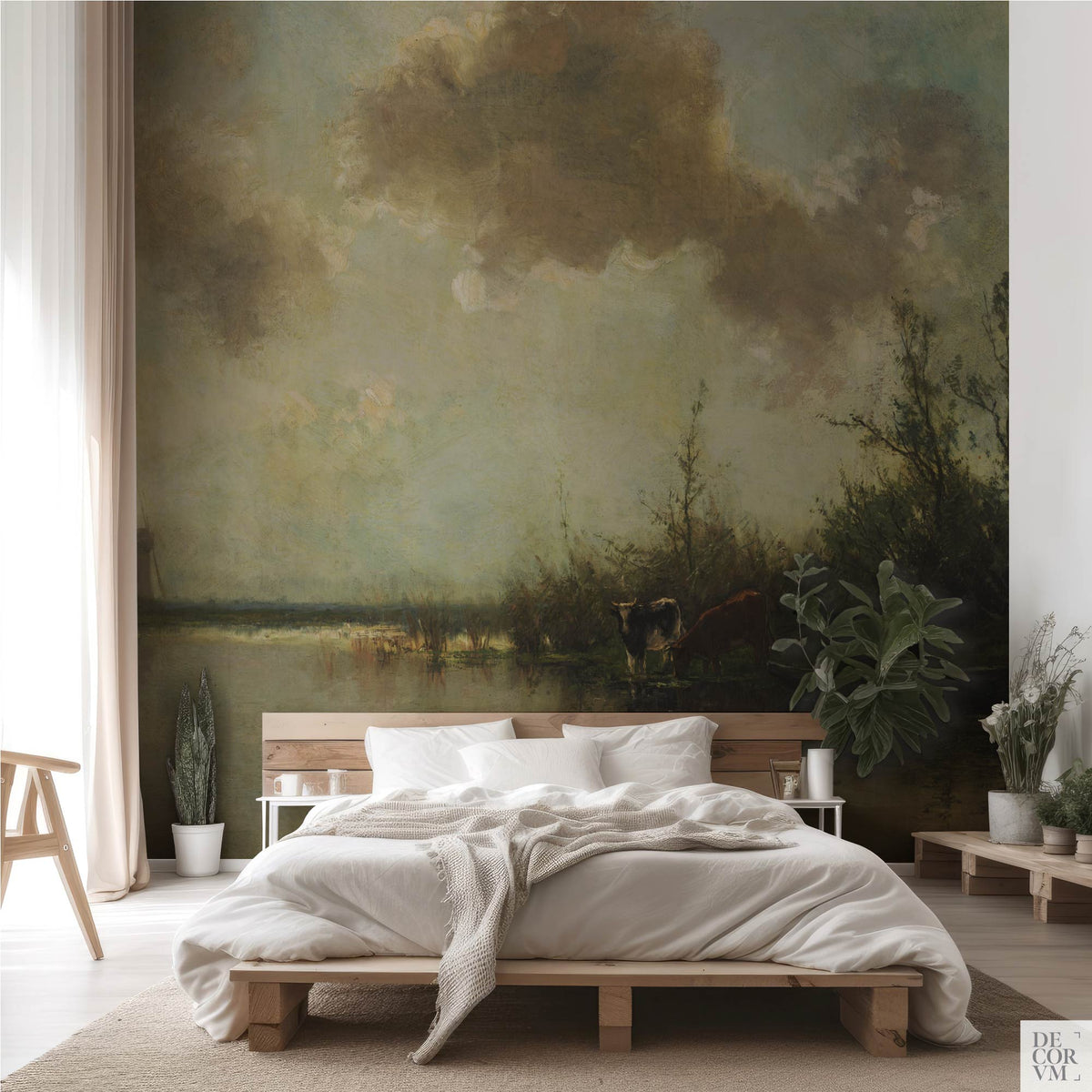 Pastoral cows on a riverbank wallpaper mural in a natural bohemian bedroom with wooden platform bed and plants