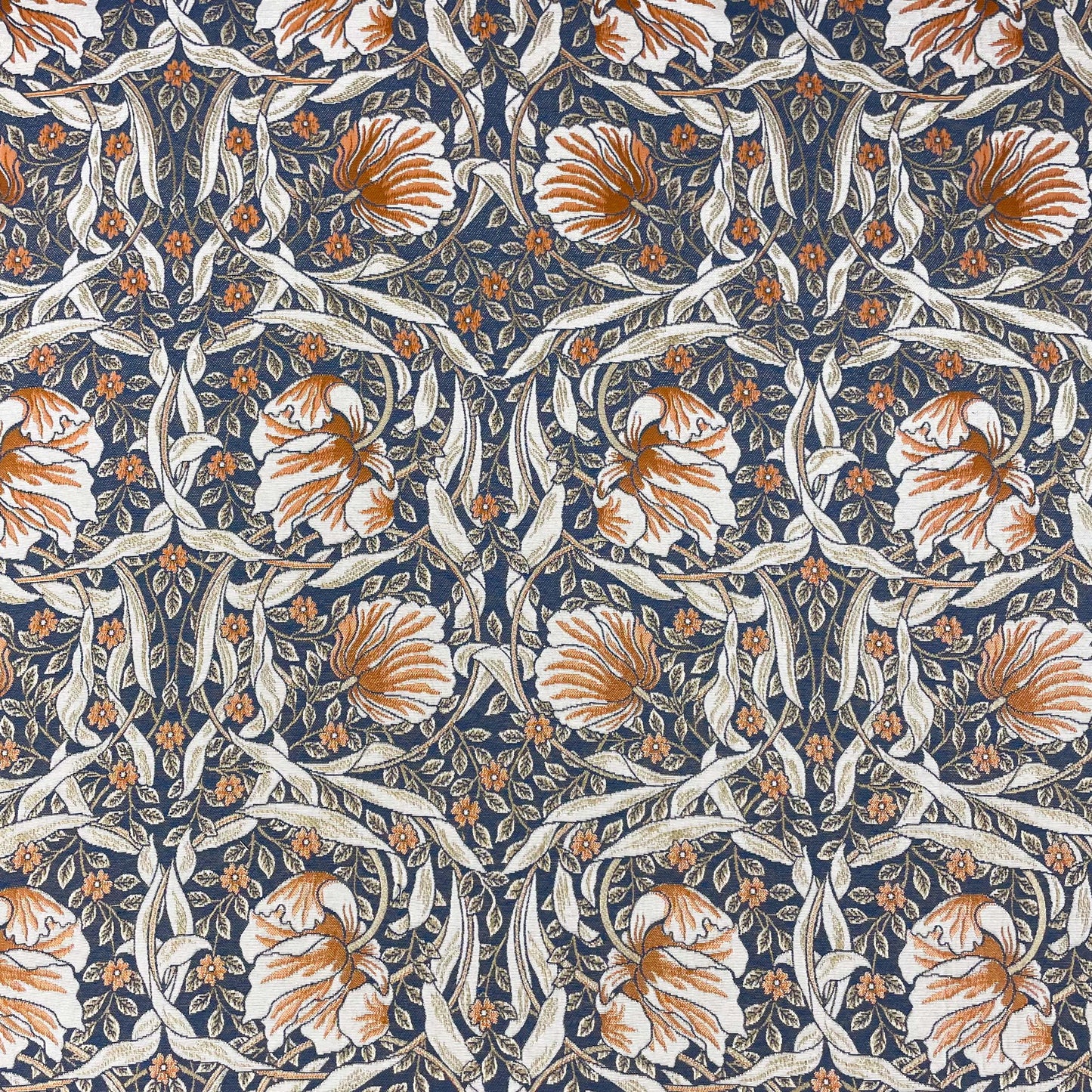 Top-down flat view of the Pimpernel Jacquard Fabric pattern, showcasing the intricate, symmetrical design of rust and white flowers against dark blue foliage.