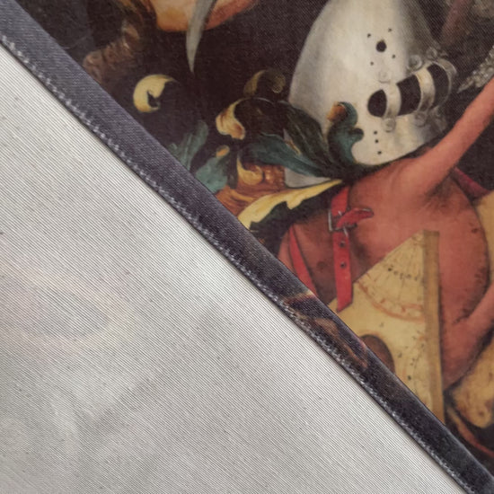Bruegel Fall of the Rebel Angels wall tapestry product video — hands showing fabric drape, Decorvm woven label, and Northern Renaissance print quality.