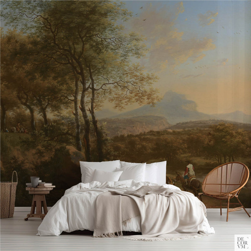 Italian river landscape wallpaper mural in a bright bedroom — vintage scene with distant mountain peak and rustic figures behind a white bed by Decorvm
