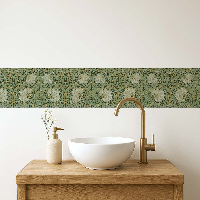 William Morris Pimpernel peel and stick wall border in sage — elegant powder room behind a white vessel sink and gold faucet by Decorvm