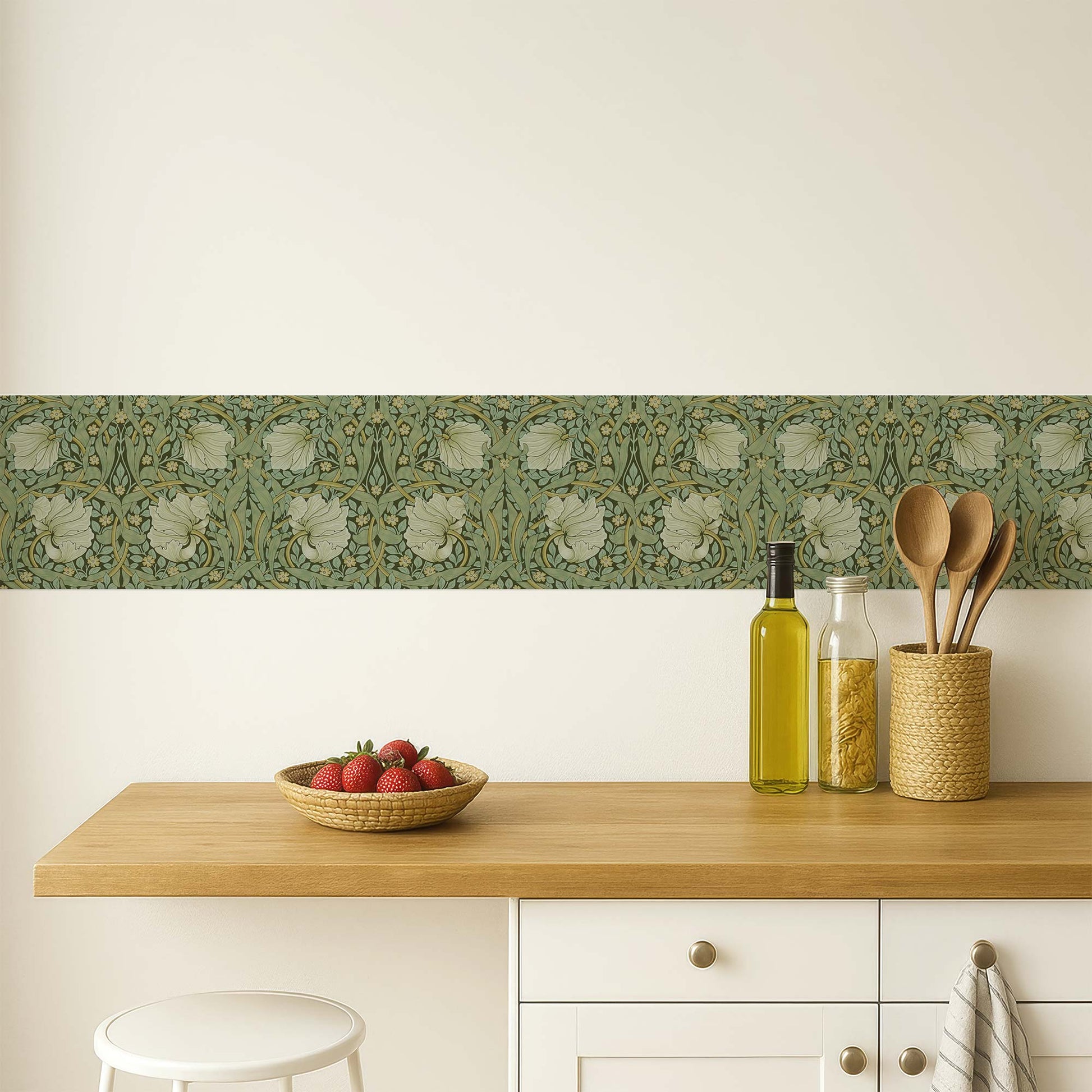 William Morris Pimpernel peel and stick wall border in sage — used as a kitchen backsplash accent above a wood countertop