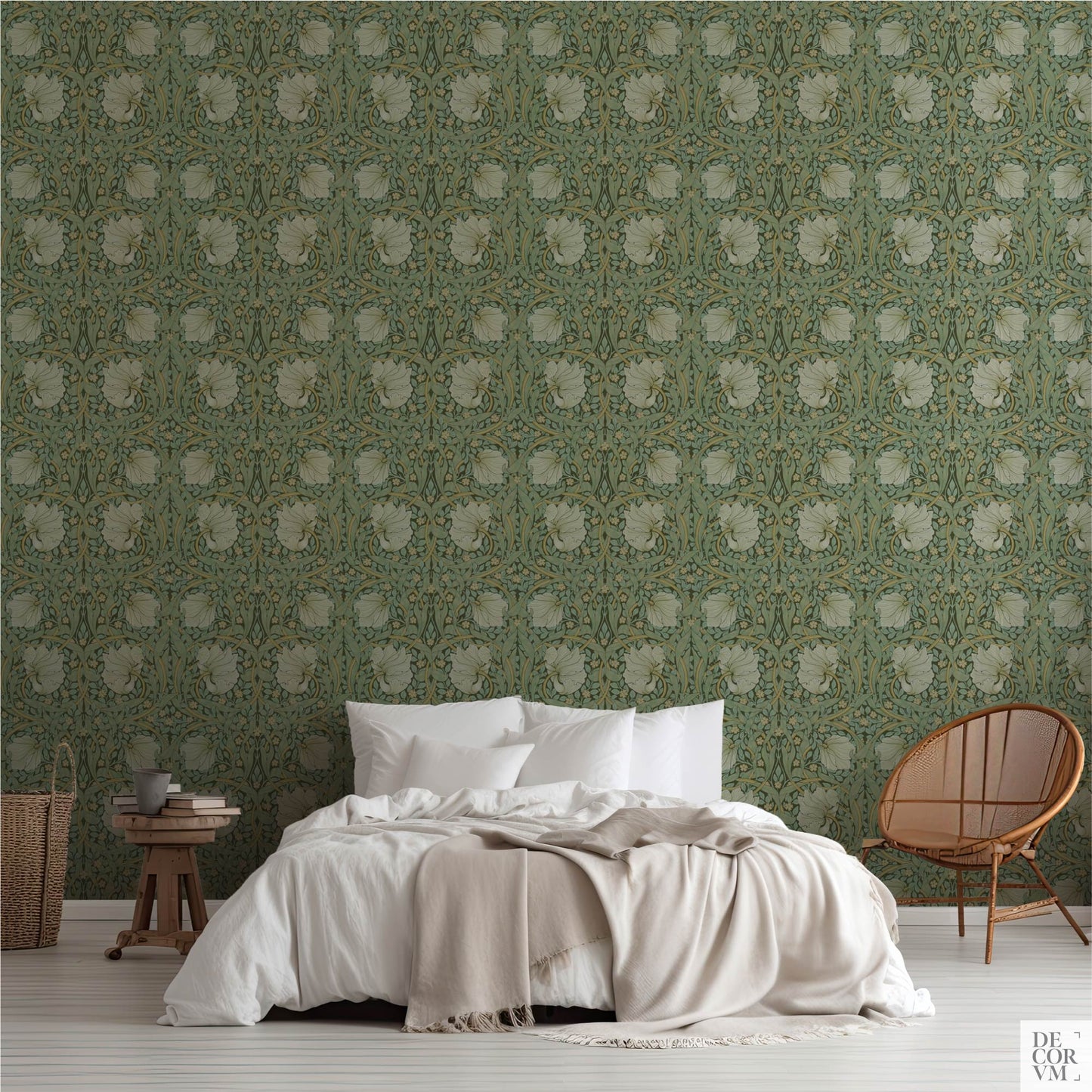 Bedroom scene featuring the William Morris Pimpernel Wallpaper Mural — Sage Arts & Crafts Decor behind a bed with white linens, a wooden stool, and a rattan chair on the right.