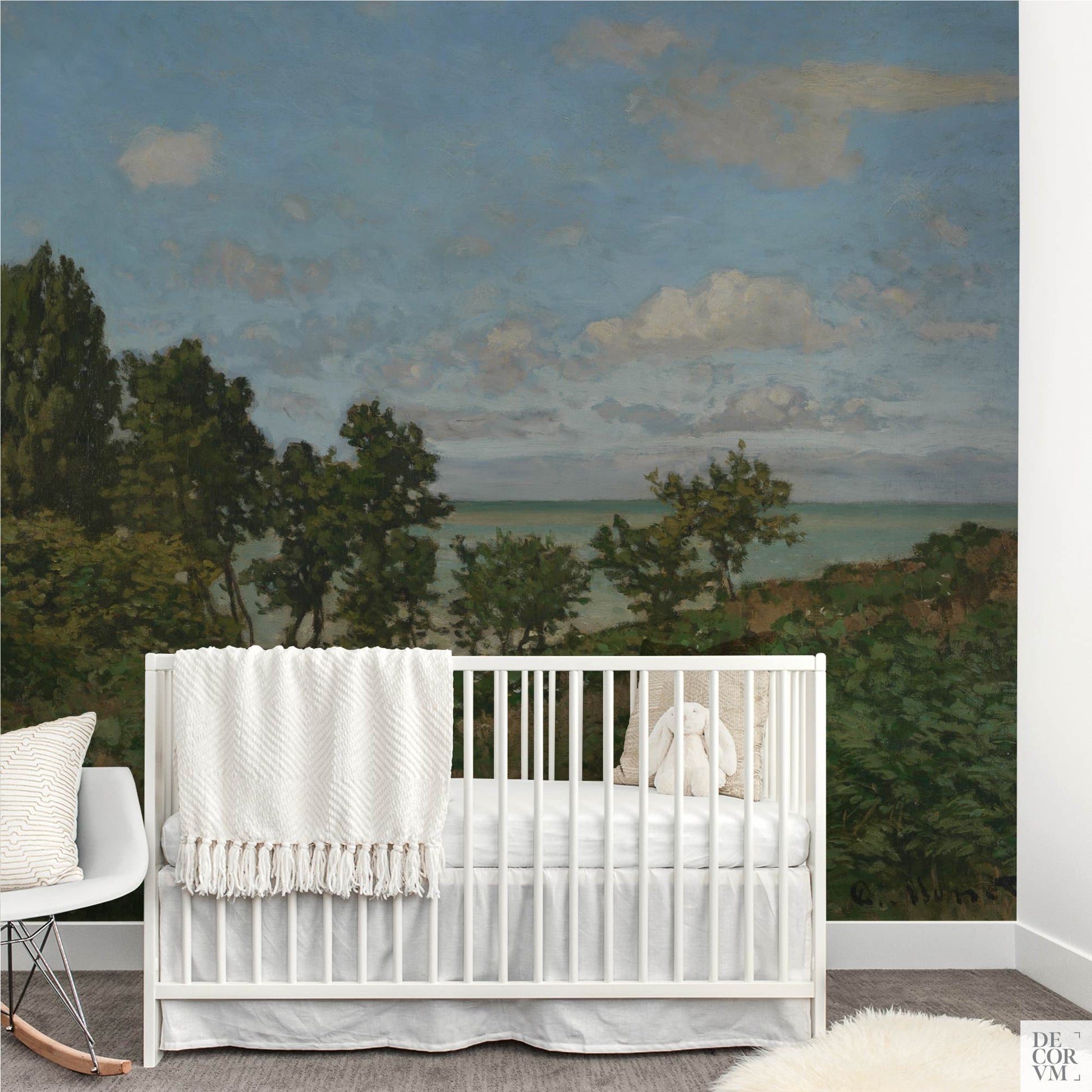 Monet coastal landscape wallpaper mural in a nursery — calming 19th-century impressionist seaside scene behind a white baby crib