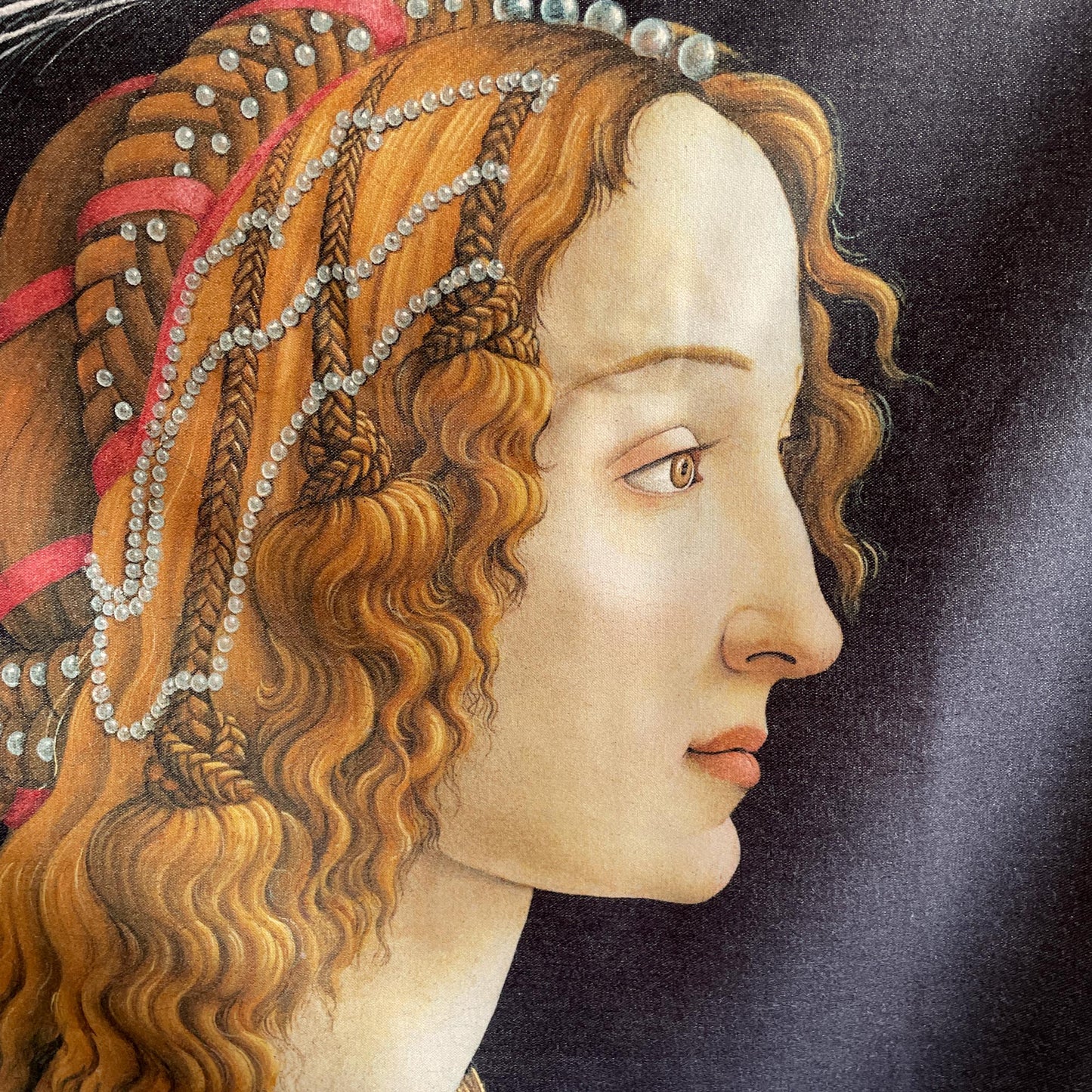 Close-up of Simonetta Vespucci's pearled plaited hair and profile — painting detail from Botticelli's Idealised Portrait of a Lady, ca. 1480.