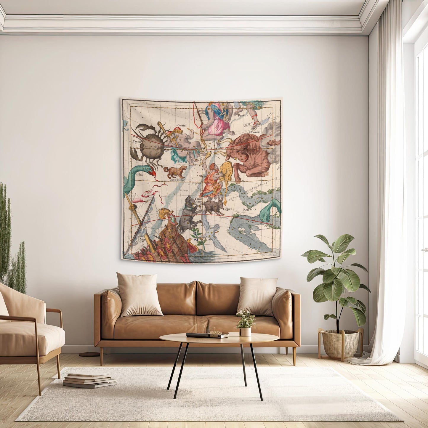 Orion and Taurus constellation wall tapestry hanging above a tan leather sofa in a dark academia living room.