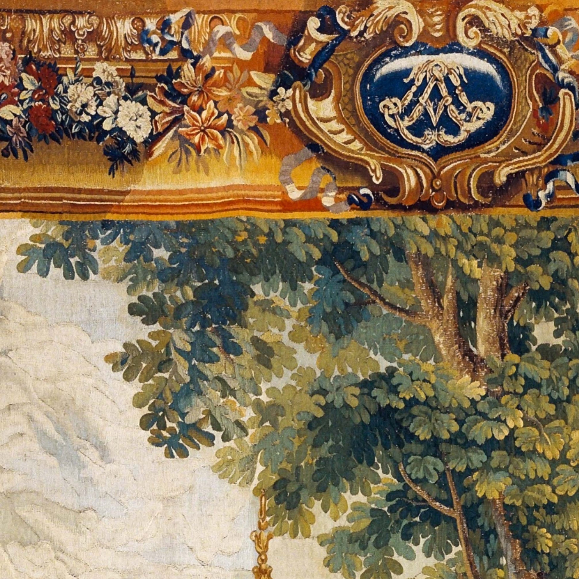 Detail shot of the grandmillennial fabric art featuring an ornate floral border, decorative crest, and lush green botanical foliage from the historic tapestry design.