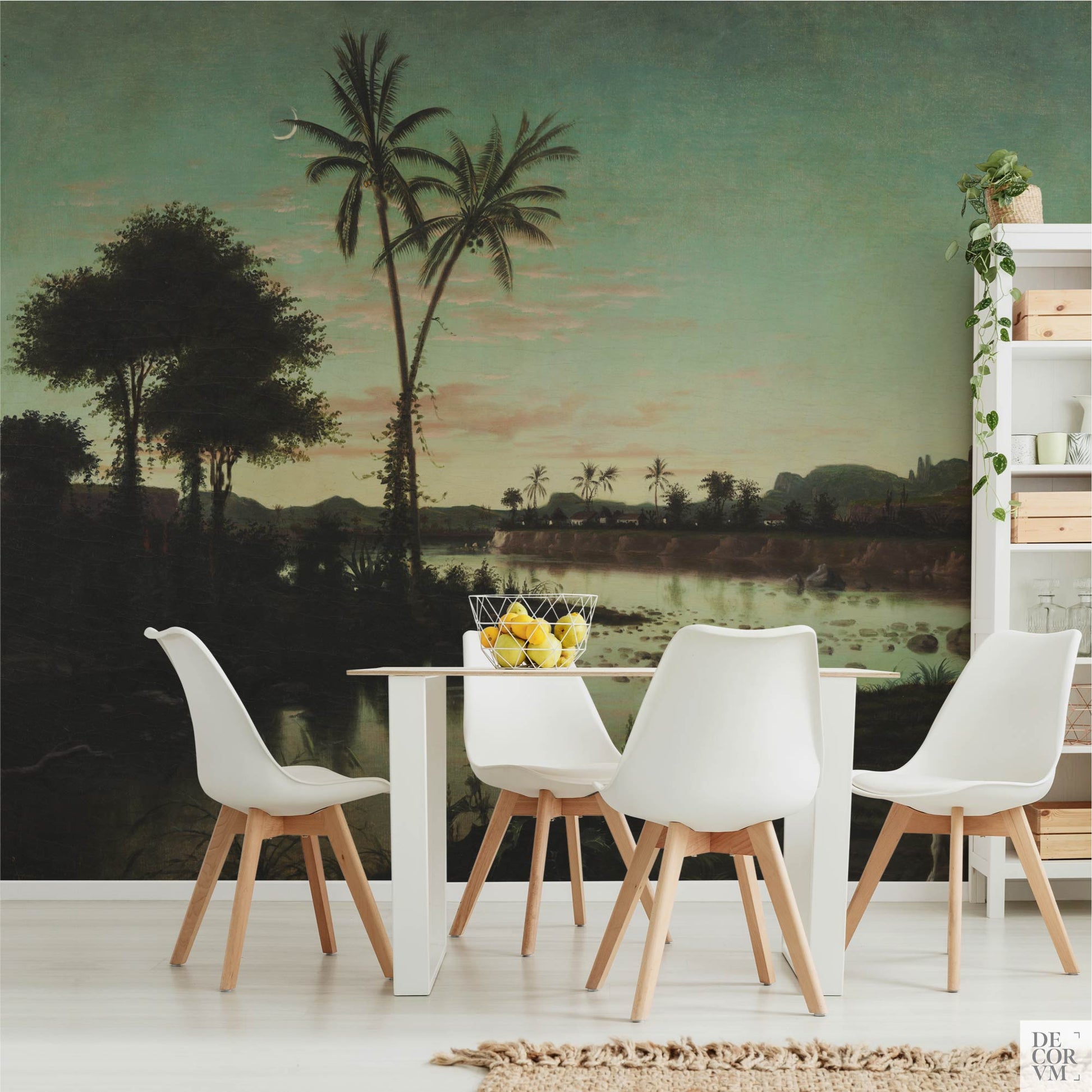 Dining room scene showcasing the Tropical Twilight Palms Wallpaper Mural — Vintage Tropical Decor behind a white table and chairs, alongside a white open shelving unit holding plants and crates.