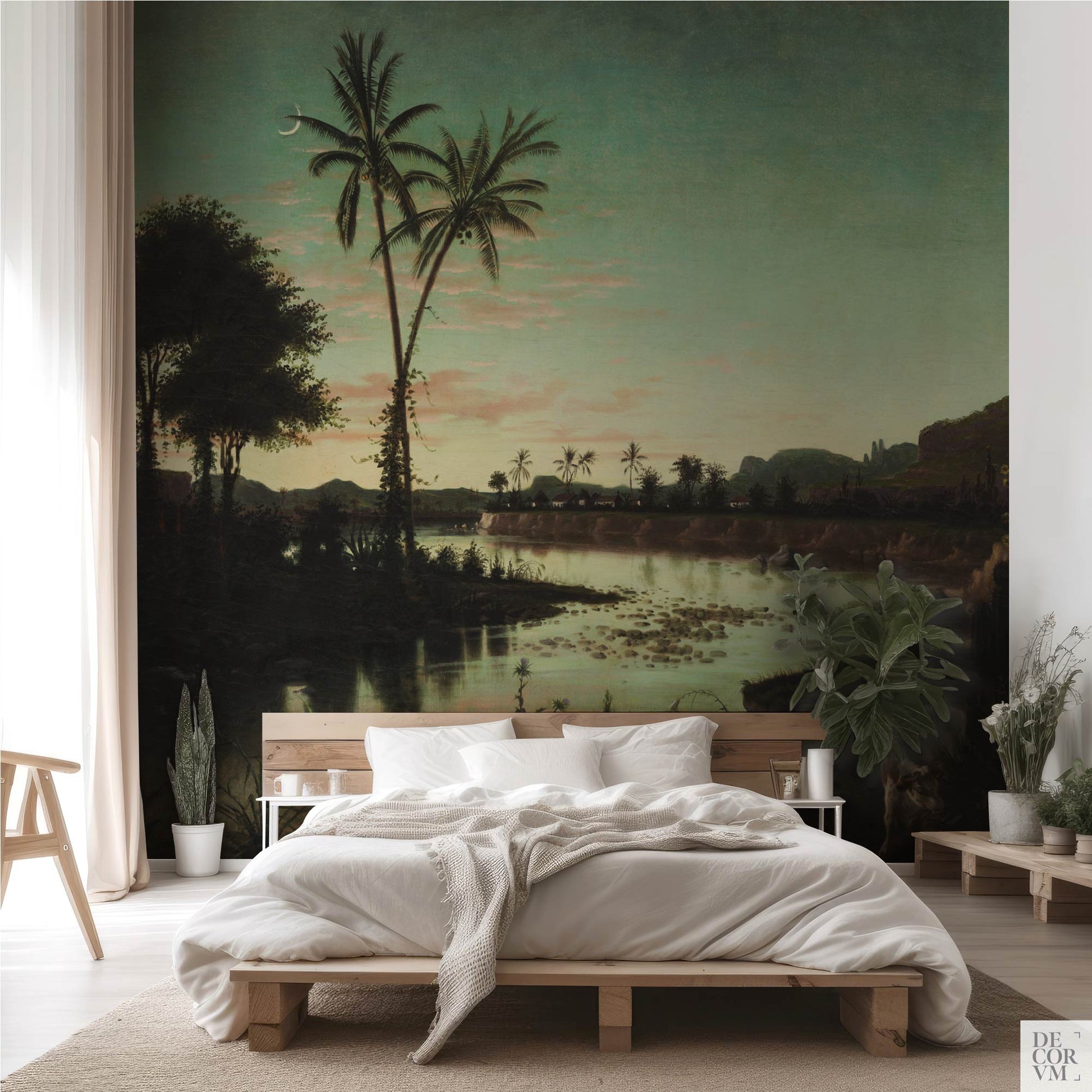 Minimalist bedroom interior showcasing the Tropical Twilight Palms Wallpaper Mural — Vintage Tropical Decor behind a low wooden bed frame, sheer curtains, and potted plants.