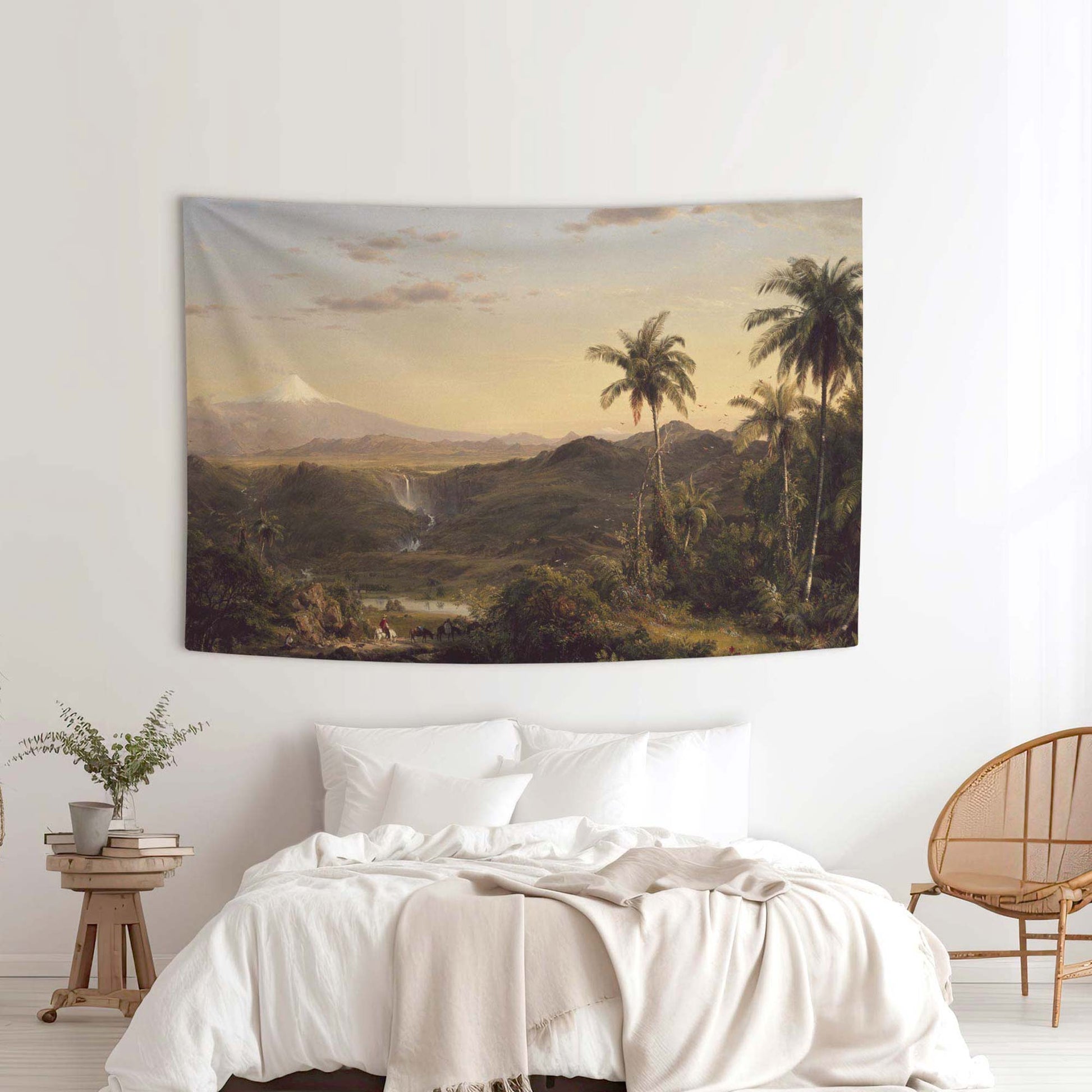Frederic Church Cotopaxi wall tapestry in a minimalist white bedroom with a rattan chair and linen bedding by Decorvm.