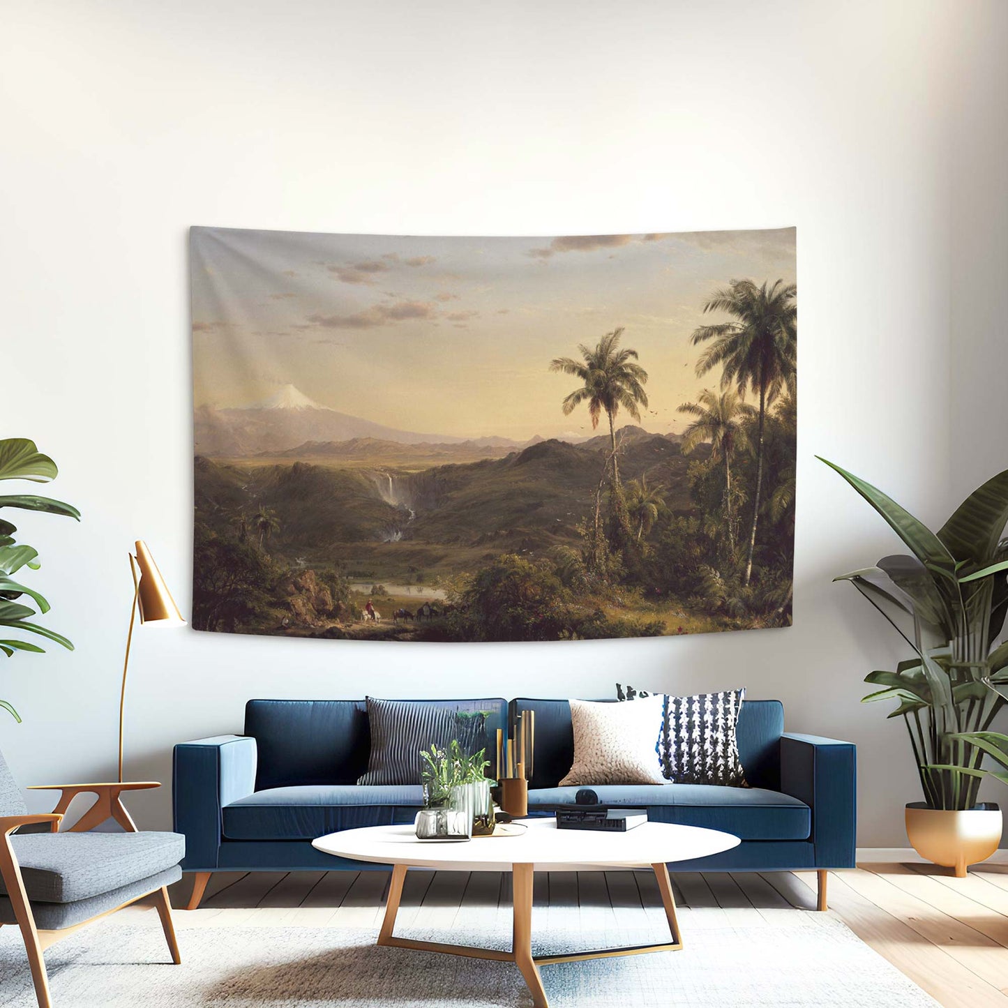 Frederic Church Cotopaxi wall tapestry in a mid-century modern living room with a blue sofa and houseplants by Decorvm.