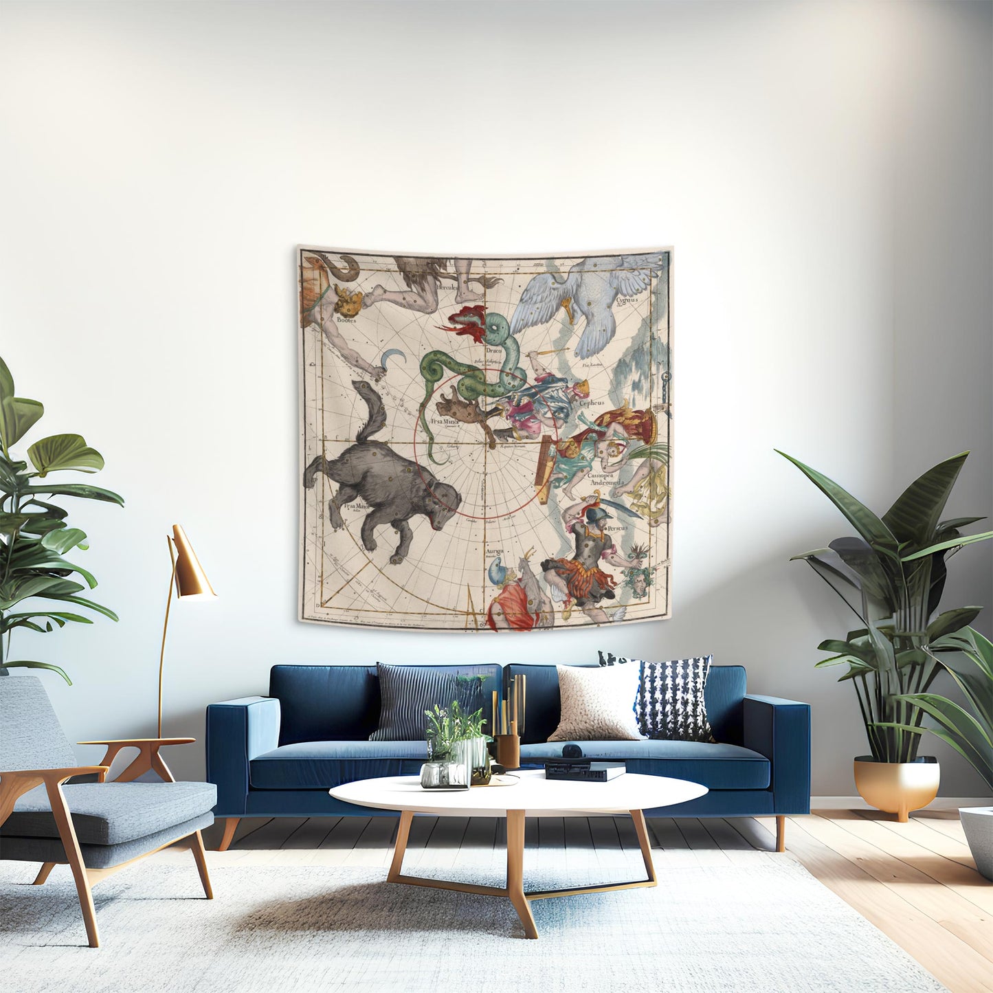 A chic mid-century modern living room styled with a classical northern constellation tapestry hanging as a dramatic statement piece above a sleek blue velvet sofa, surrounded by elegant furnishings.