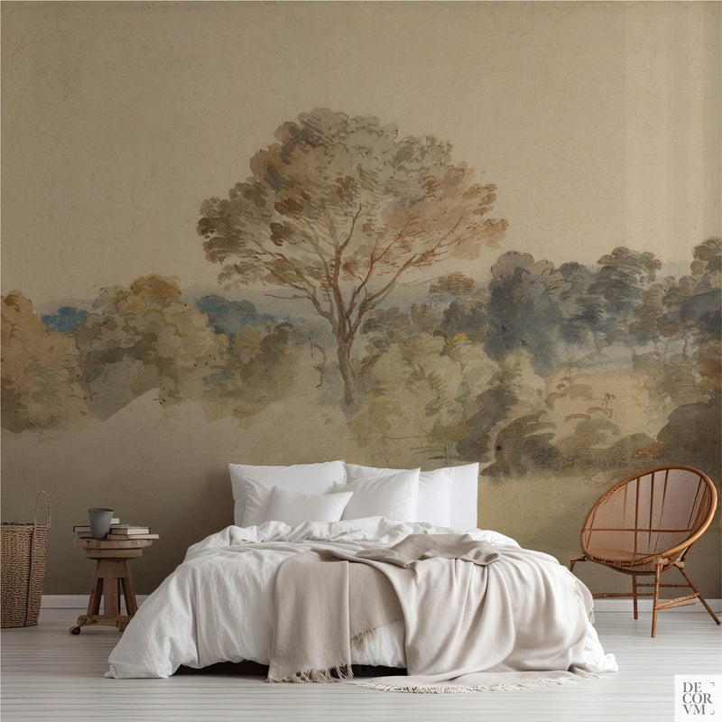 Bedroom scene featuring the Van Dyck English Landscape Wallpaper Mural — Dark Academia Decor behind a bed with white linens, a wooden stool, and a rattan chair on the right.