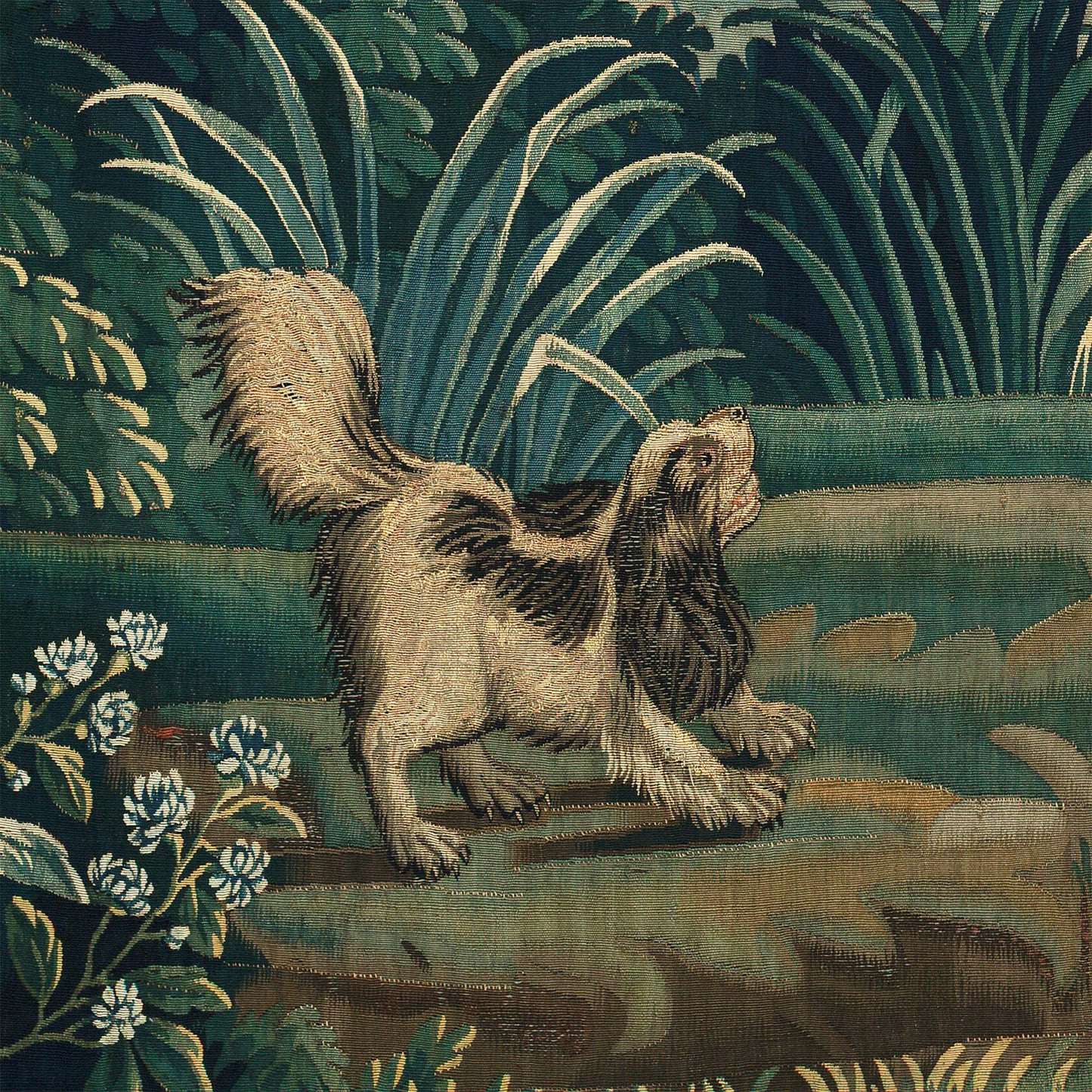 Spaniel playing in the grass beside white wildflowers — design detail from the 18th-century French verdure chateau garden.