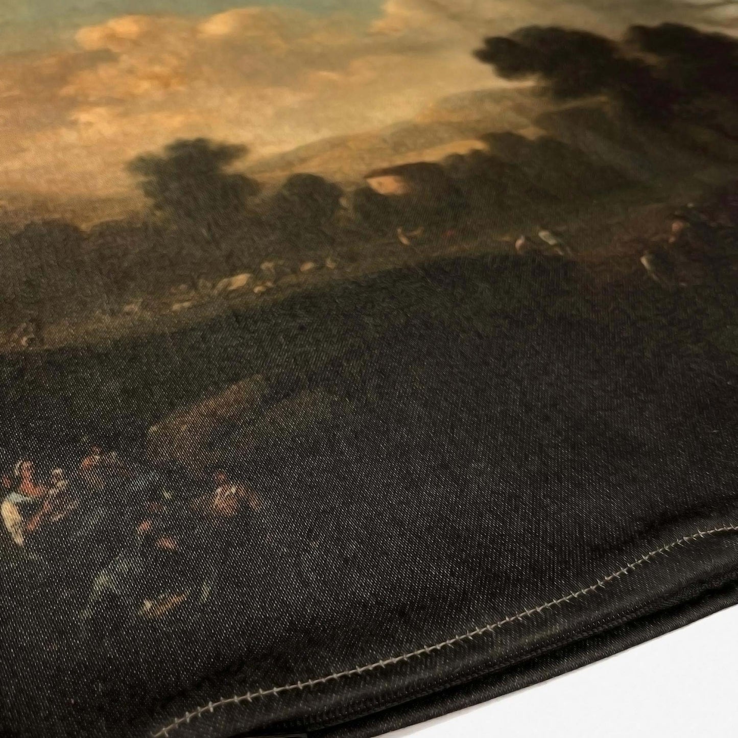Bottom stitched hem of the Dutch pastoral landscape pillow cover showing the earth-toned print.