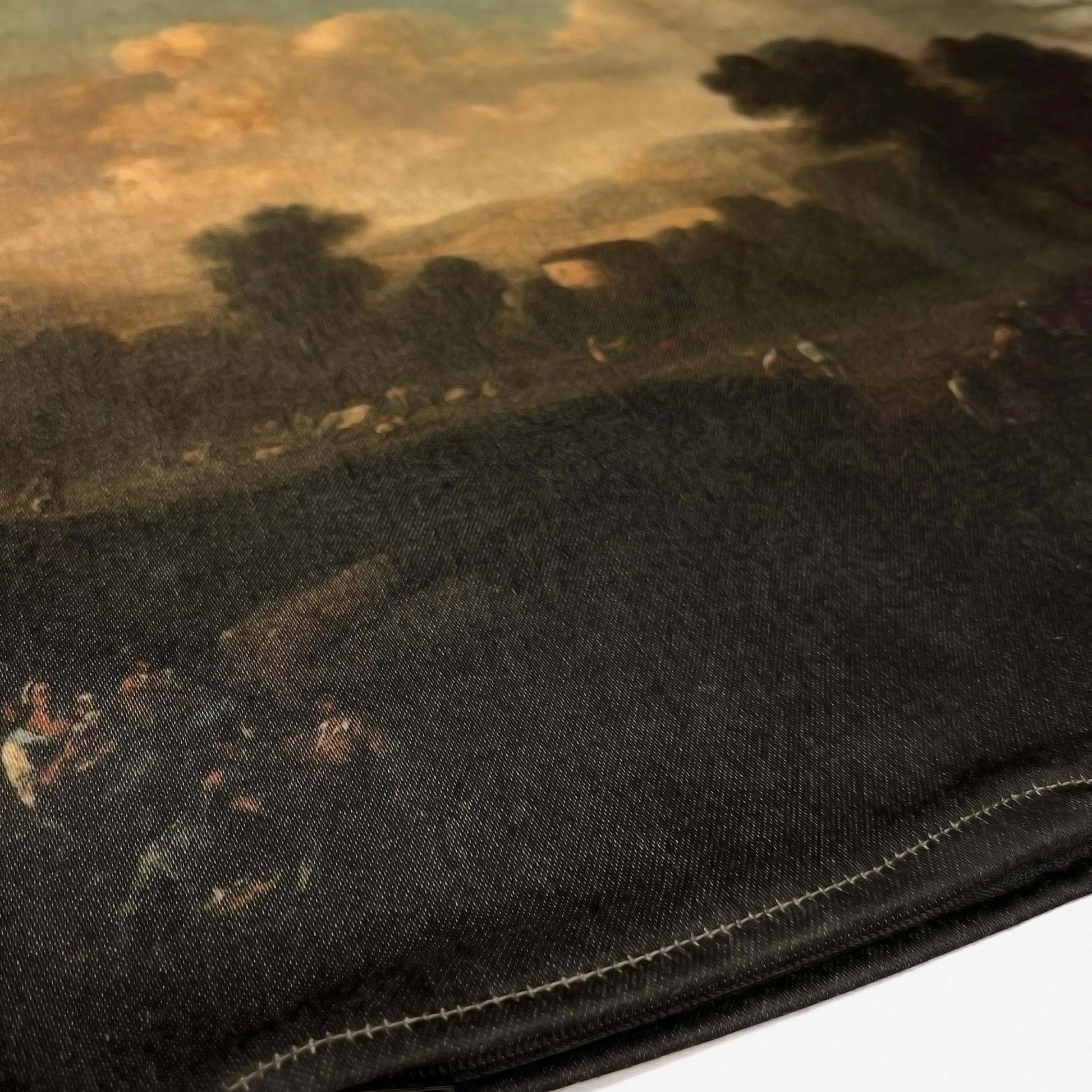 Bottom stitched hem of the Dutch pastoral landscape pillow cover showing the earth-toned print.