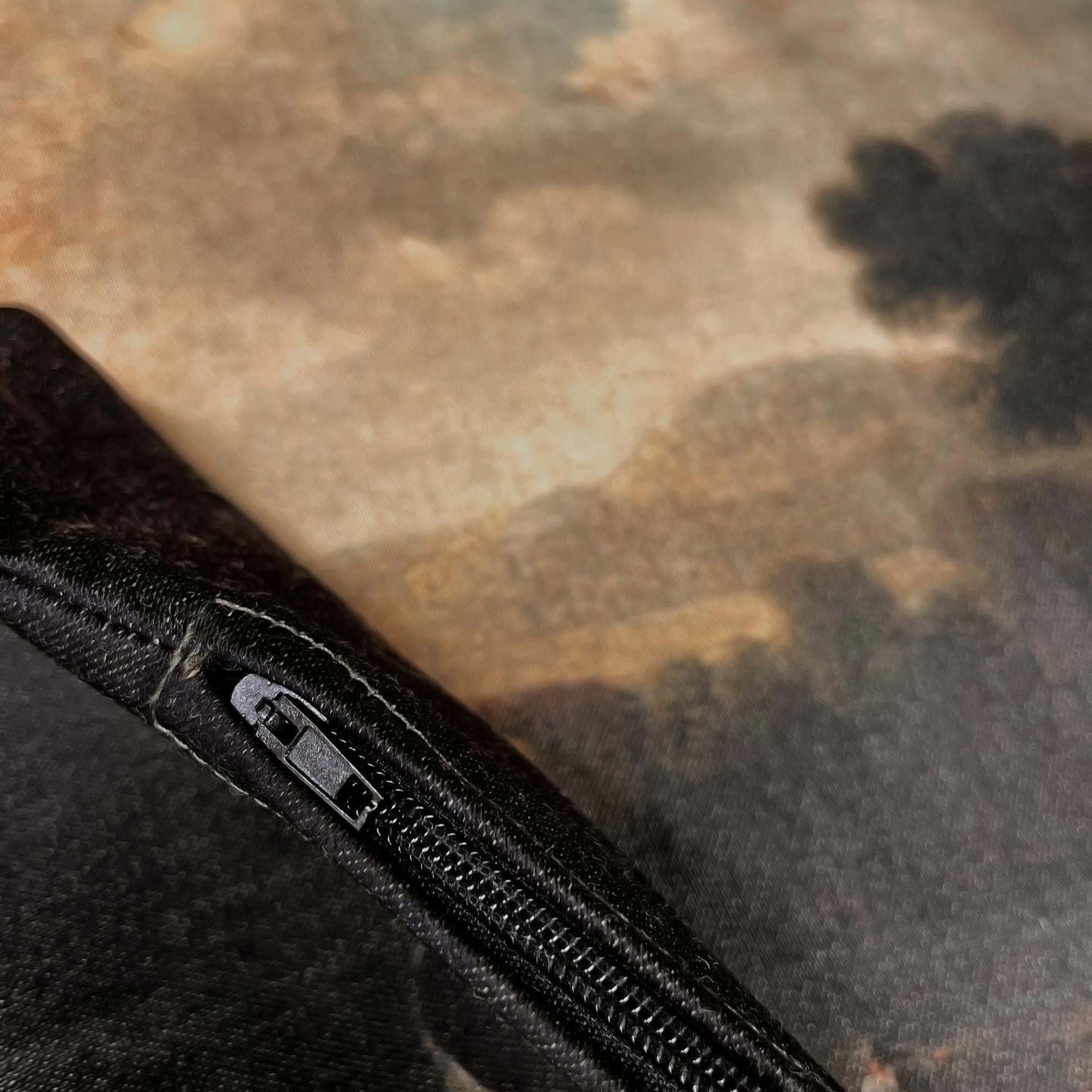 Hidden black zipper on the Dutch pastoral landscape pillow cover.