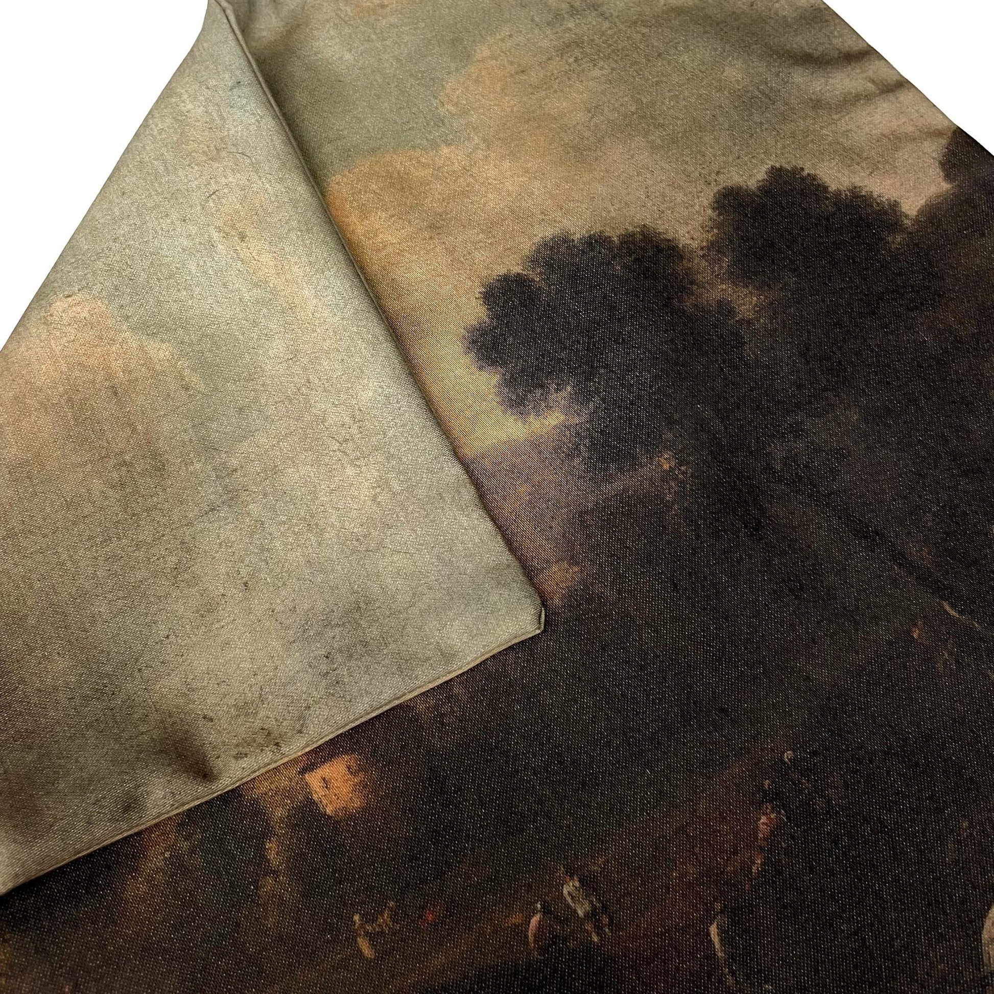 Folded Dutch pastoral landscape pillow cover showing the seamless edge and printed countryside scene.