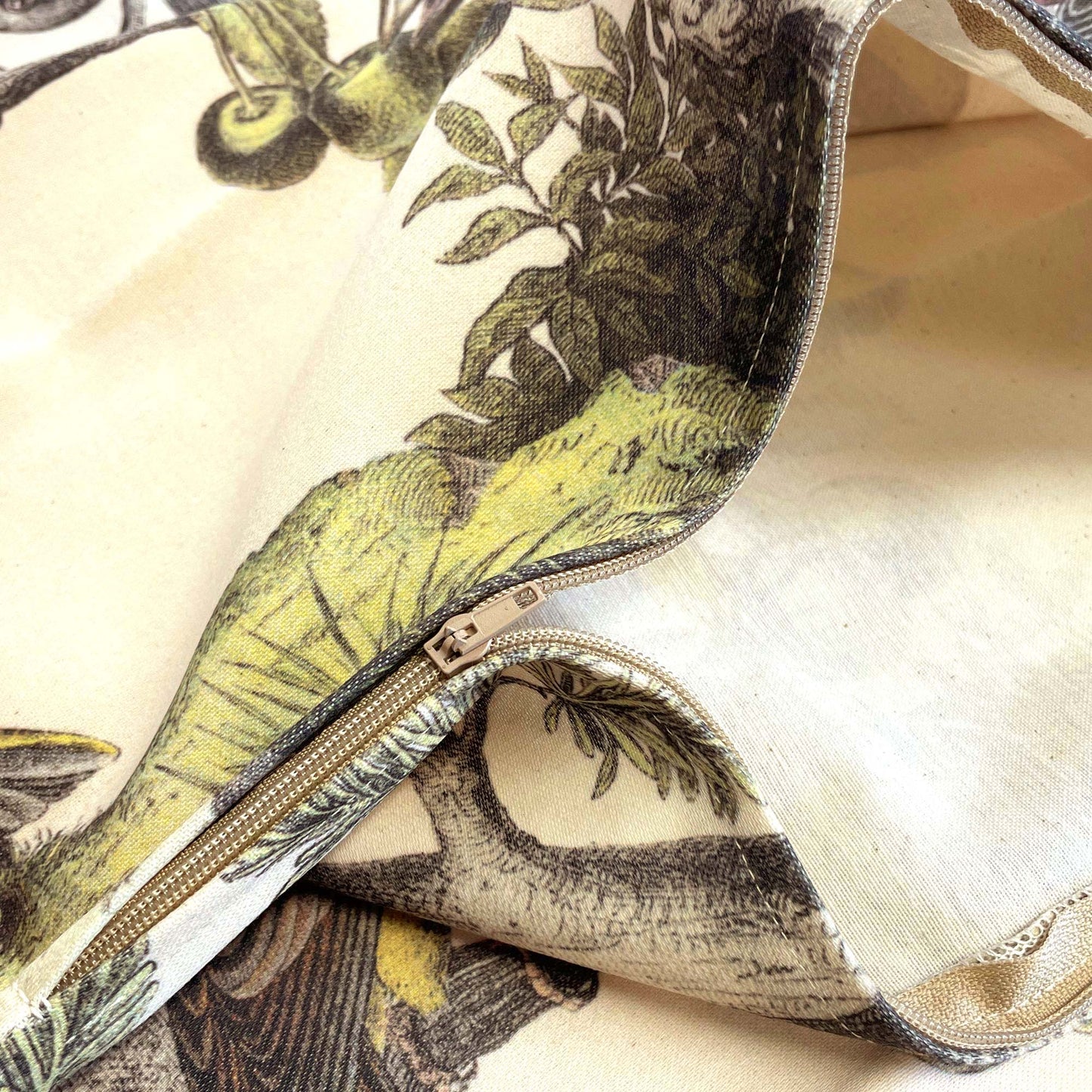 Open zipper and stitching detail on the vintage finches cushion cover.