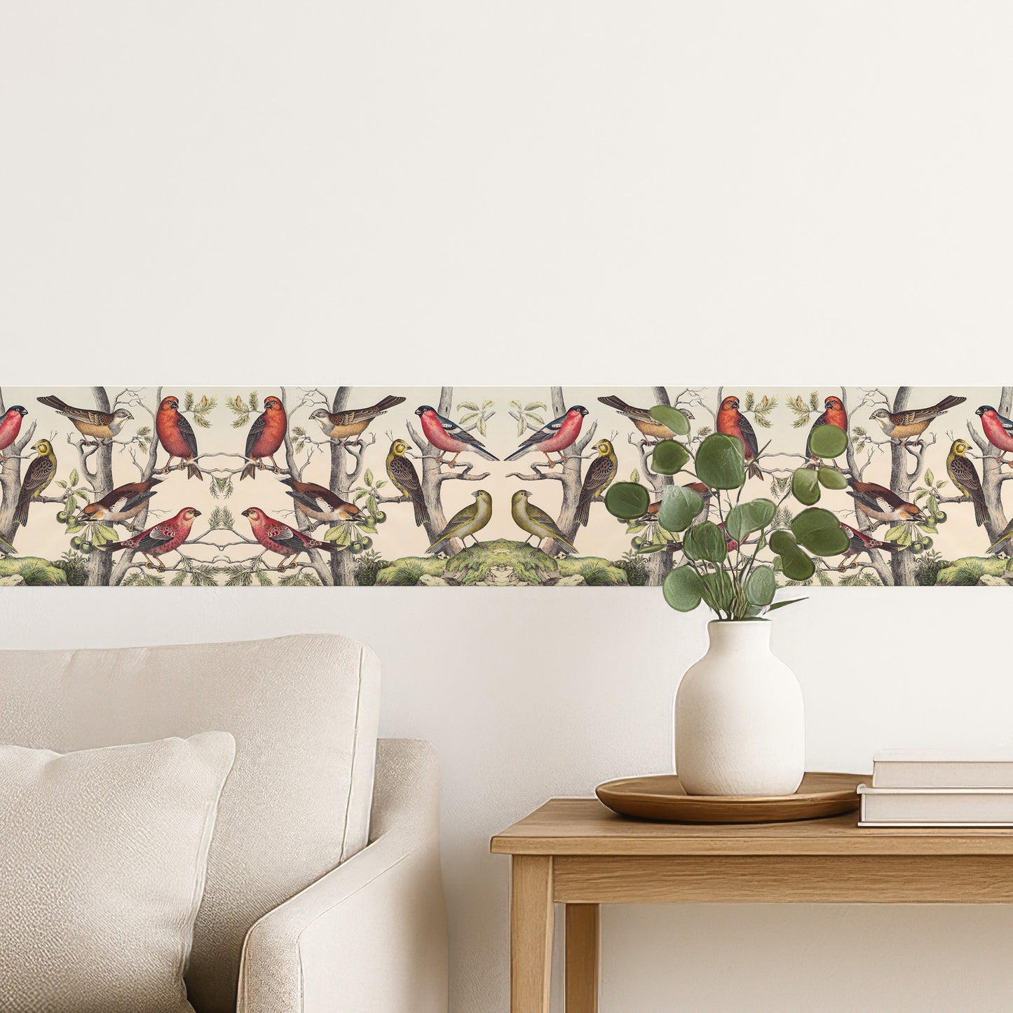 Vintage finches peel and stick wall border — cozy living space behind a neutral sofa with eucalyptus vase, natural history bird decor