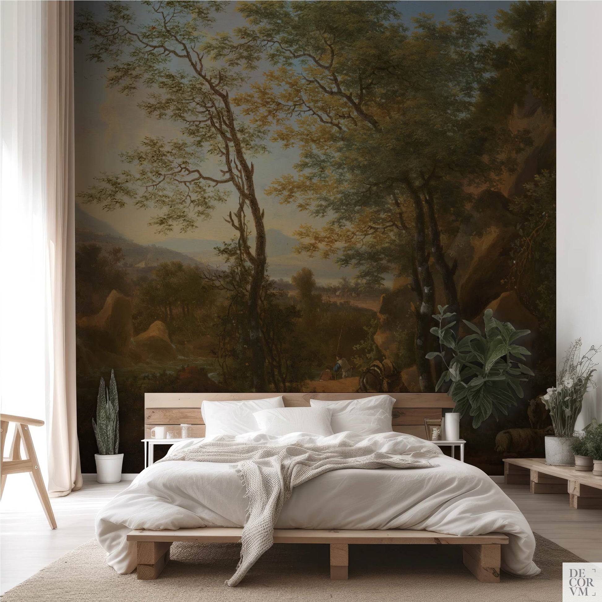 Italian mountain landscape wallpaper mural in a cozy bedroom — warm ochre and blue tones behind a natural wood platform bed by Decorvm
