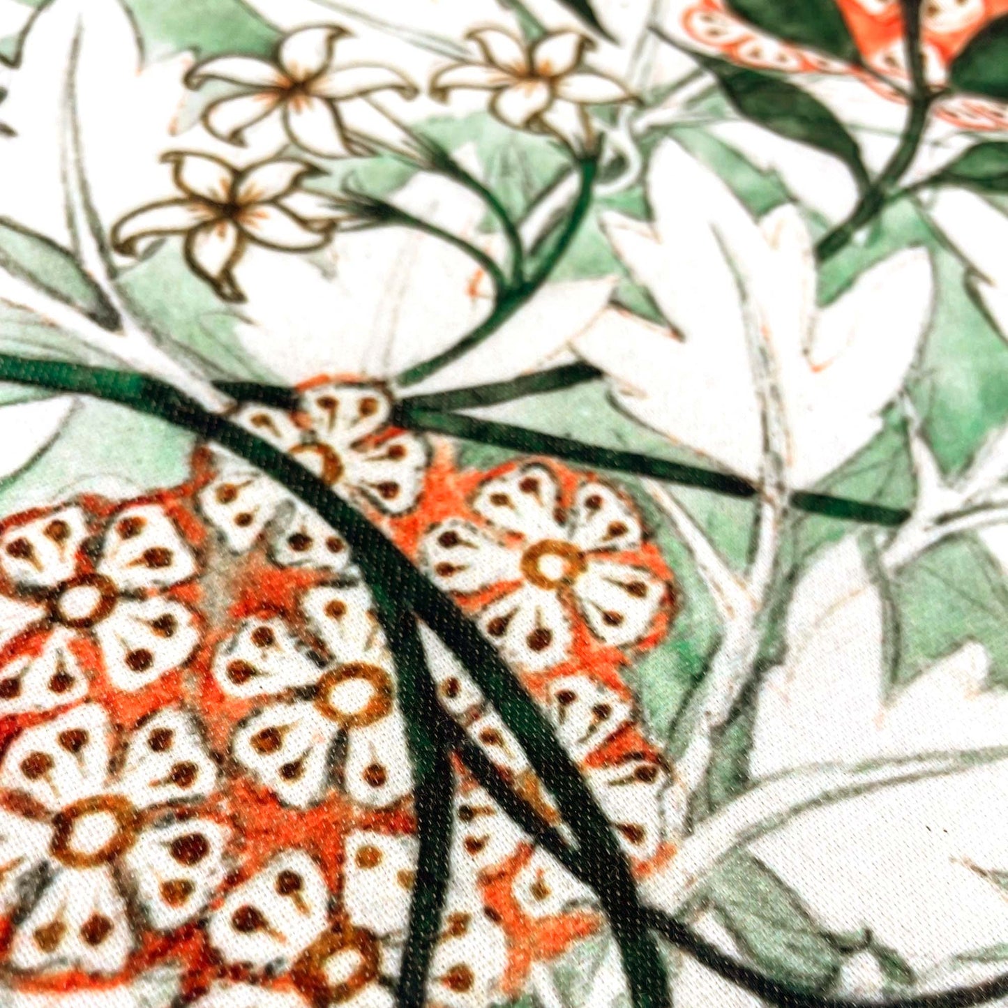 Close-up of orange floral clusters — design detail from William Morris's 1872 Jasmine pattern.