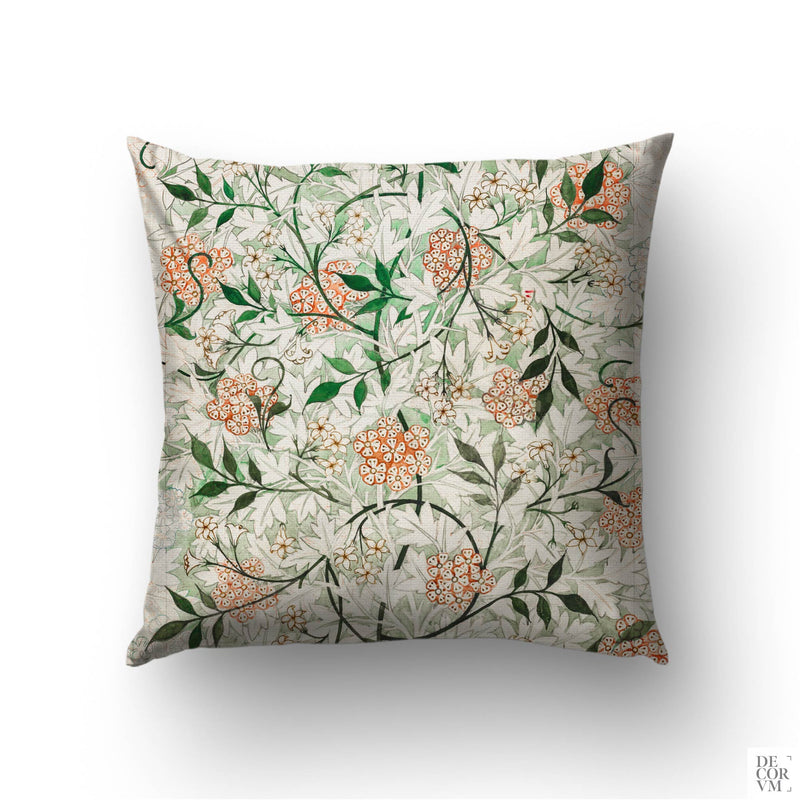 William Morris Jasmine throw pillow cover on a sofa — 1872 Arts and Crafts pattern with green vines and peach blossoms by Decorvm.
