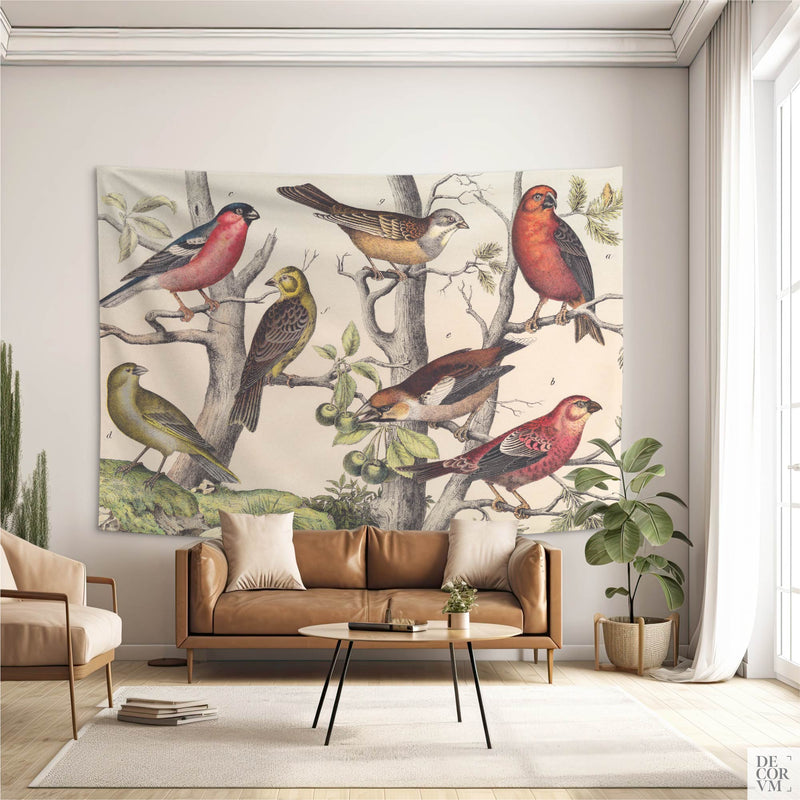 Vintage Ornithology wall tapestry as a focal point behind a tan leather sofa in a bright contemporary living space — 19th-century bird illustration decor.