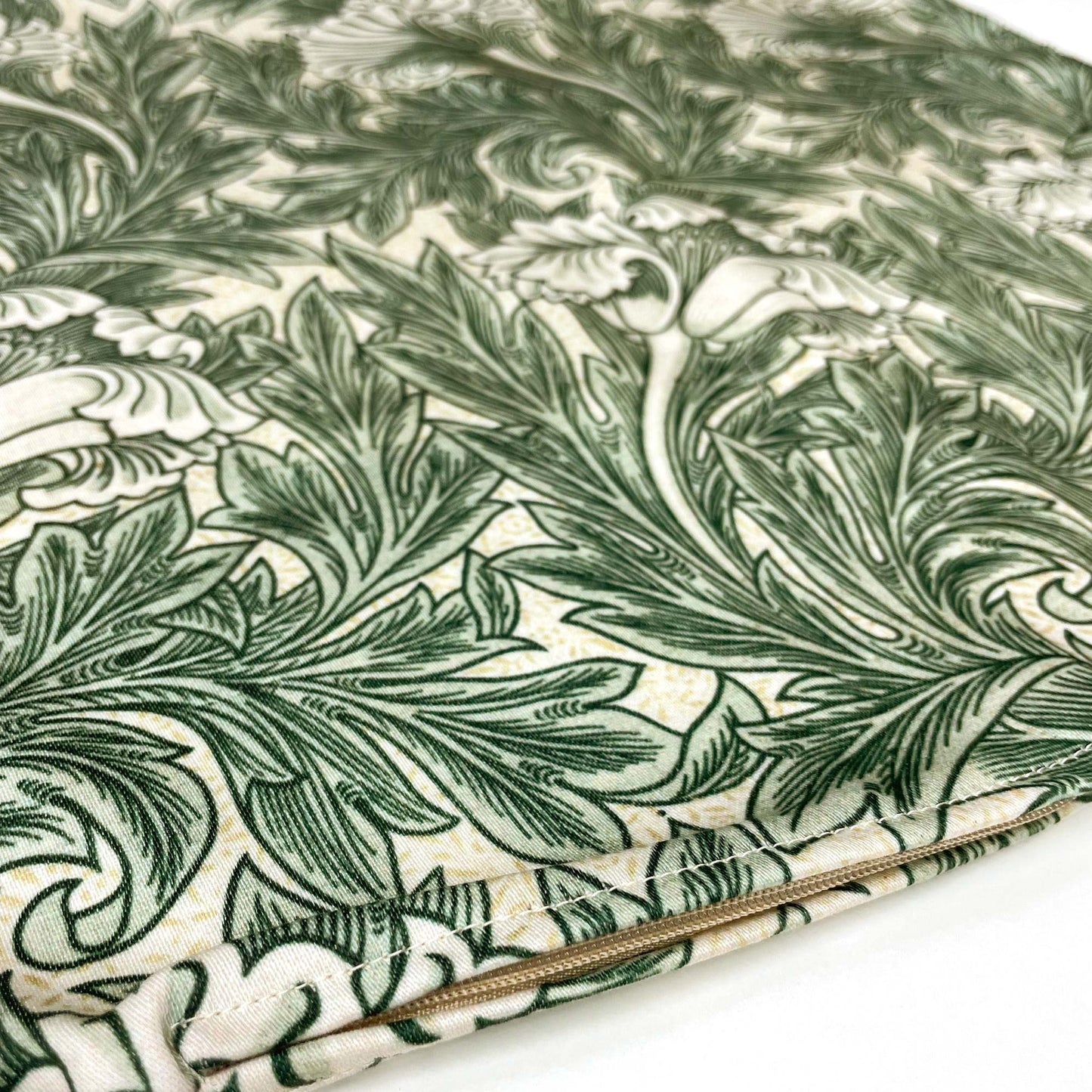 Flat lay of the William Morris Tulip pillow cover in sage green showing the delicate tulip motifs.