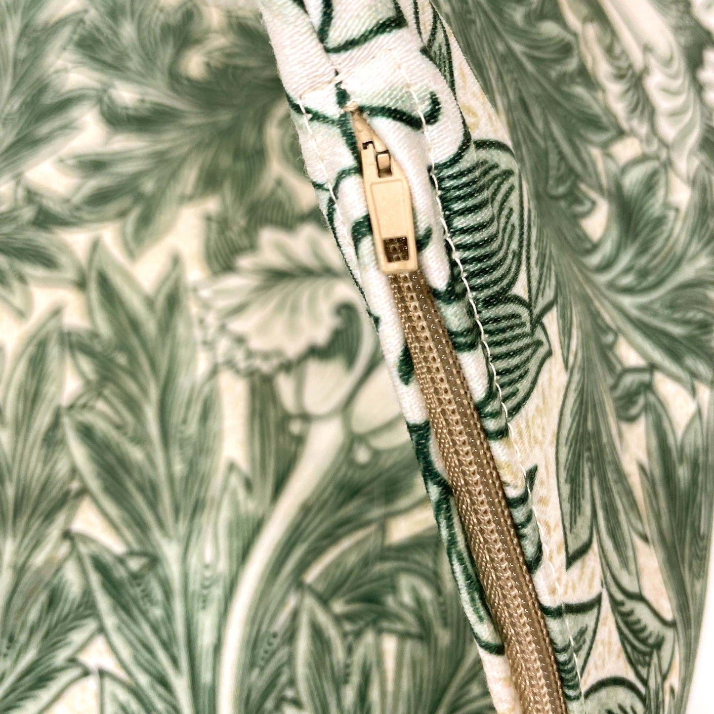 Close-up of the hidden zipper on the William Morris Tulip pillow cover.