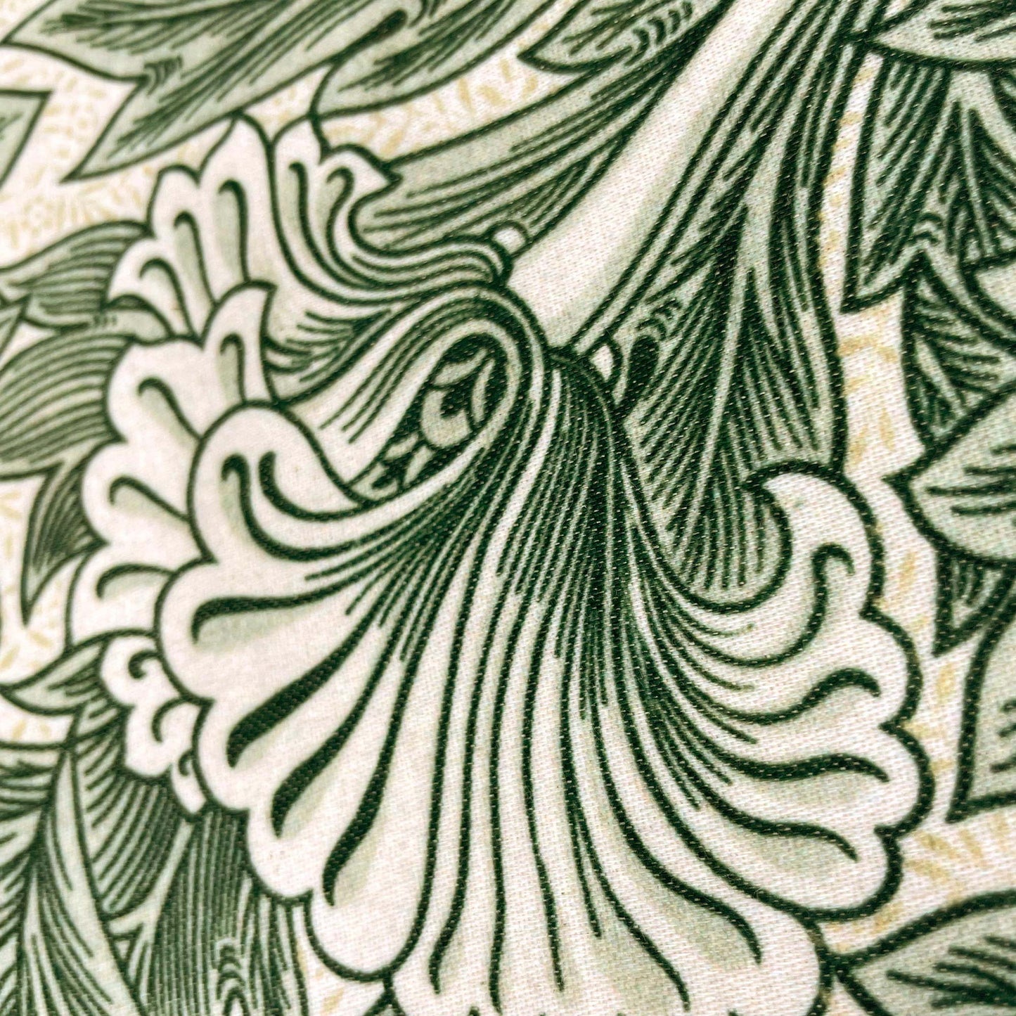Close-up of a stylised green tulip — design detail from William Morris's 1875 Tulip pattern.
