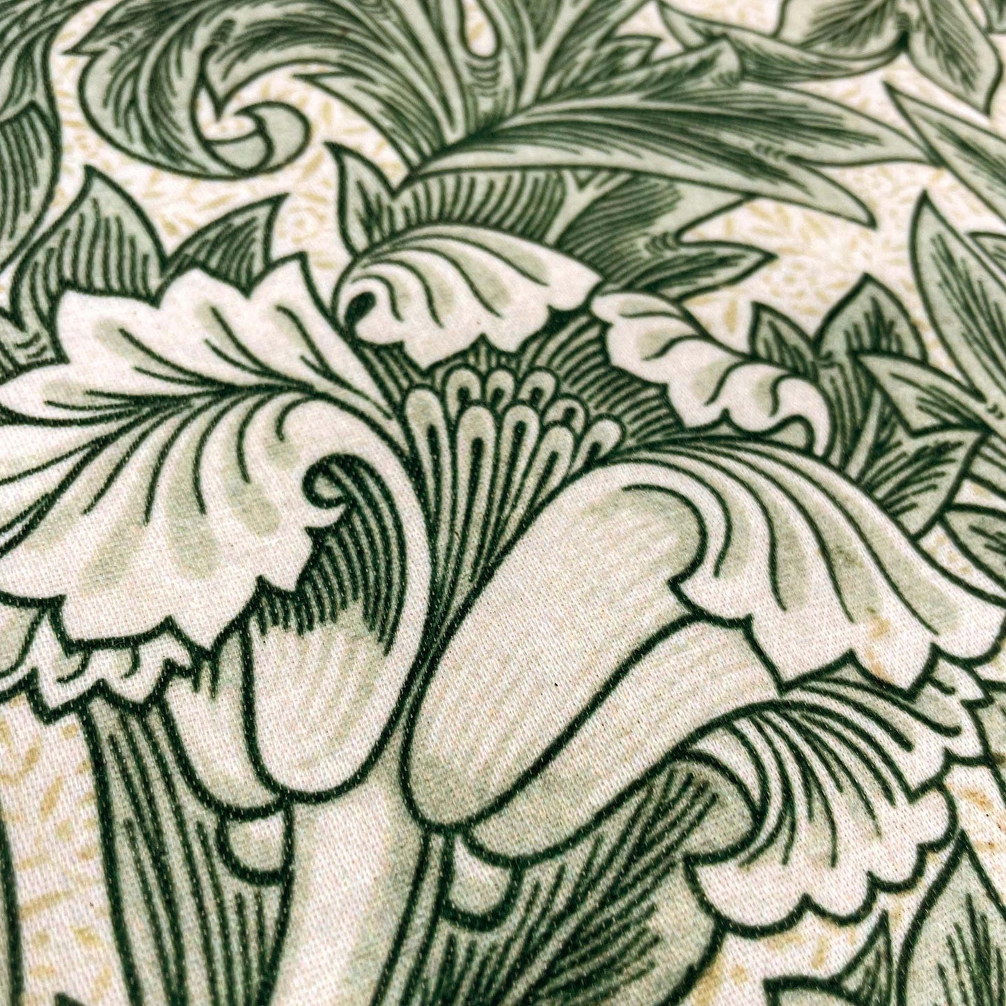 Macro of the sage cotton-polyester weave — design detail from William Morris's 1875 Tulip pattern.