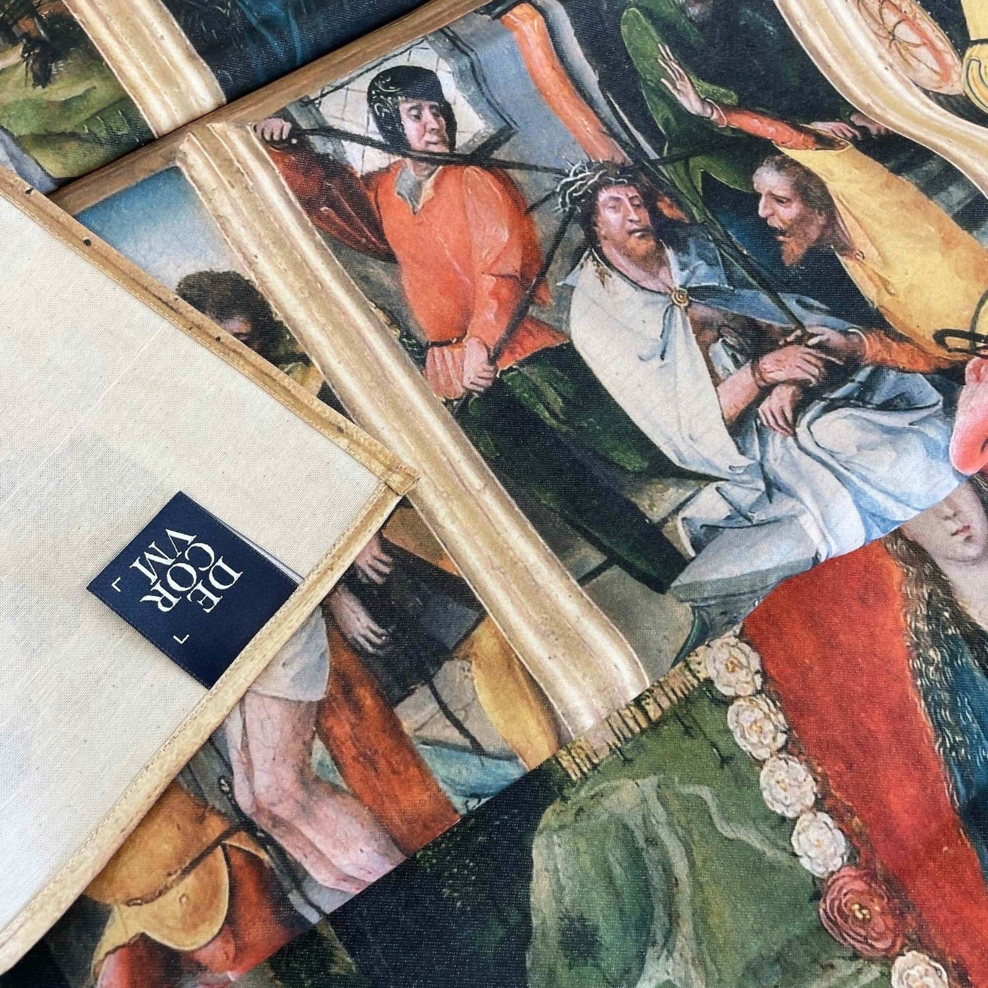 Close-up of the Virgin of the Rosary tapestry showing fabric texture, neat hem construction, and the Decorvm woven label on the reverse side.