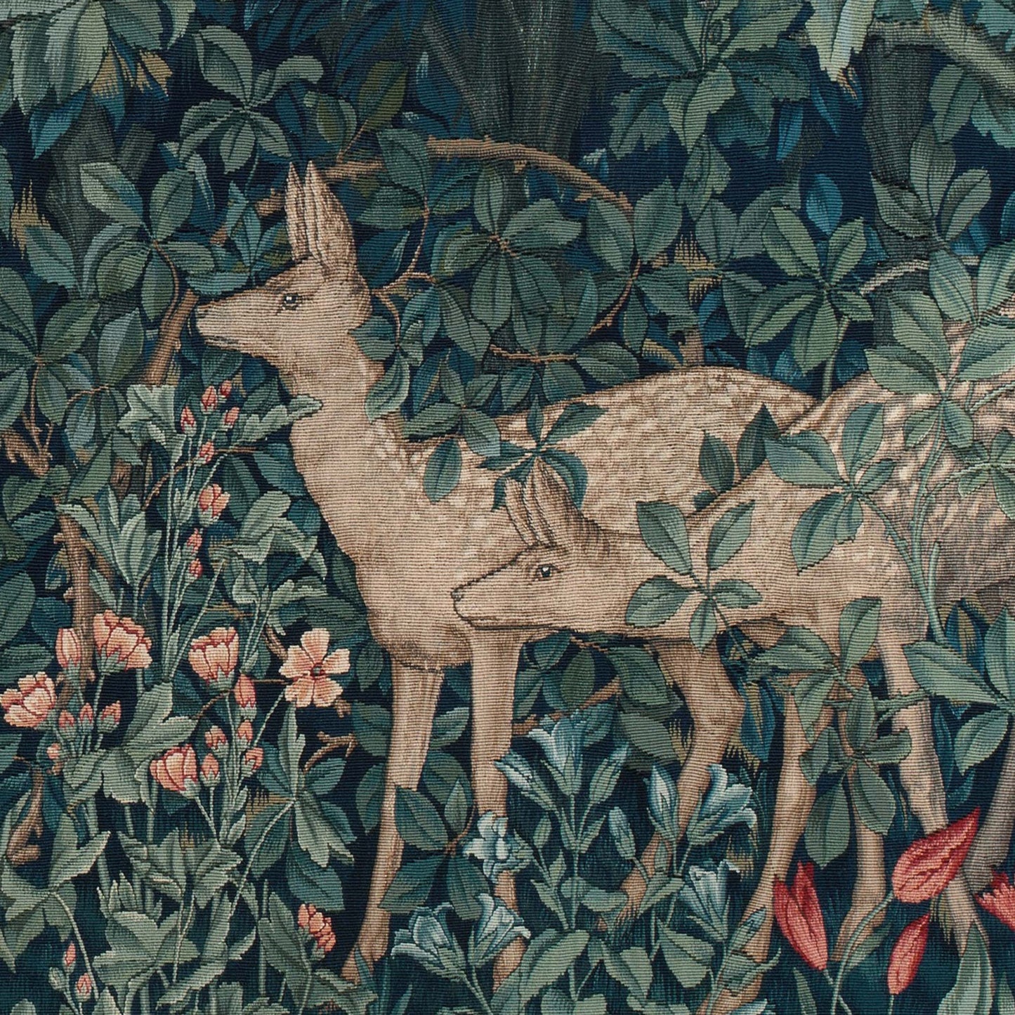 Detail of a stag and doe deer surrounded by pink wildflowers and dense foliage from the William Morris Greenery tapestry.