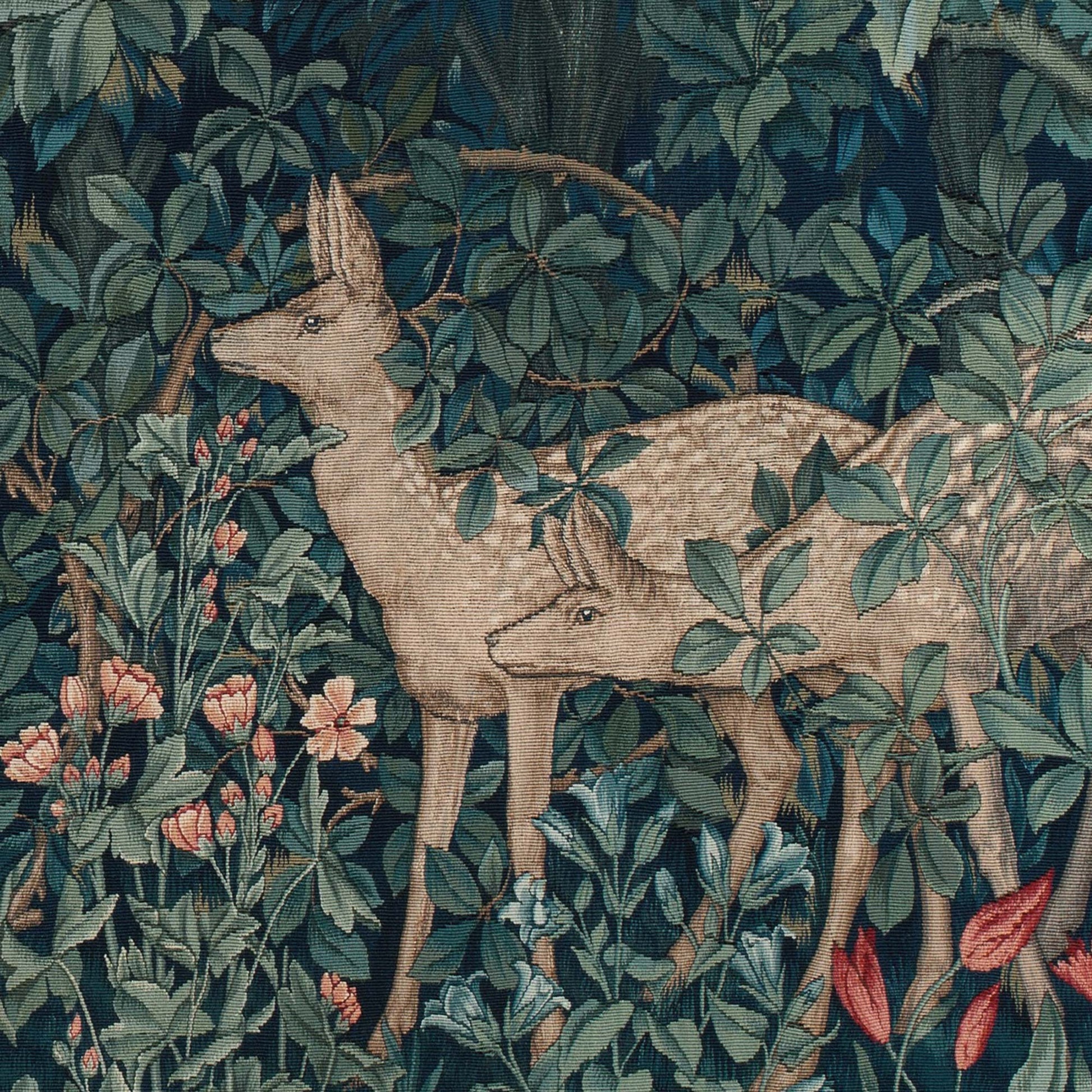 Detail of a stag and doe deer surrounded by pink wildflowers and dense foliage from the William Morris Greenery tapestry.