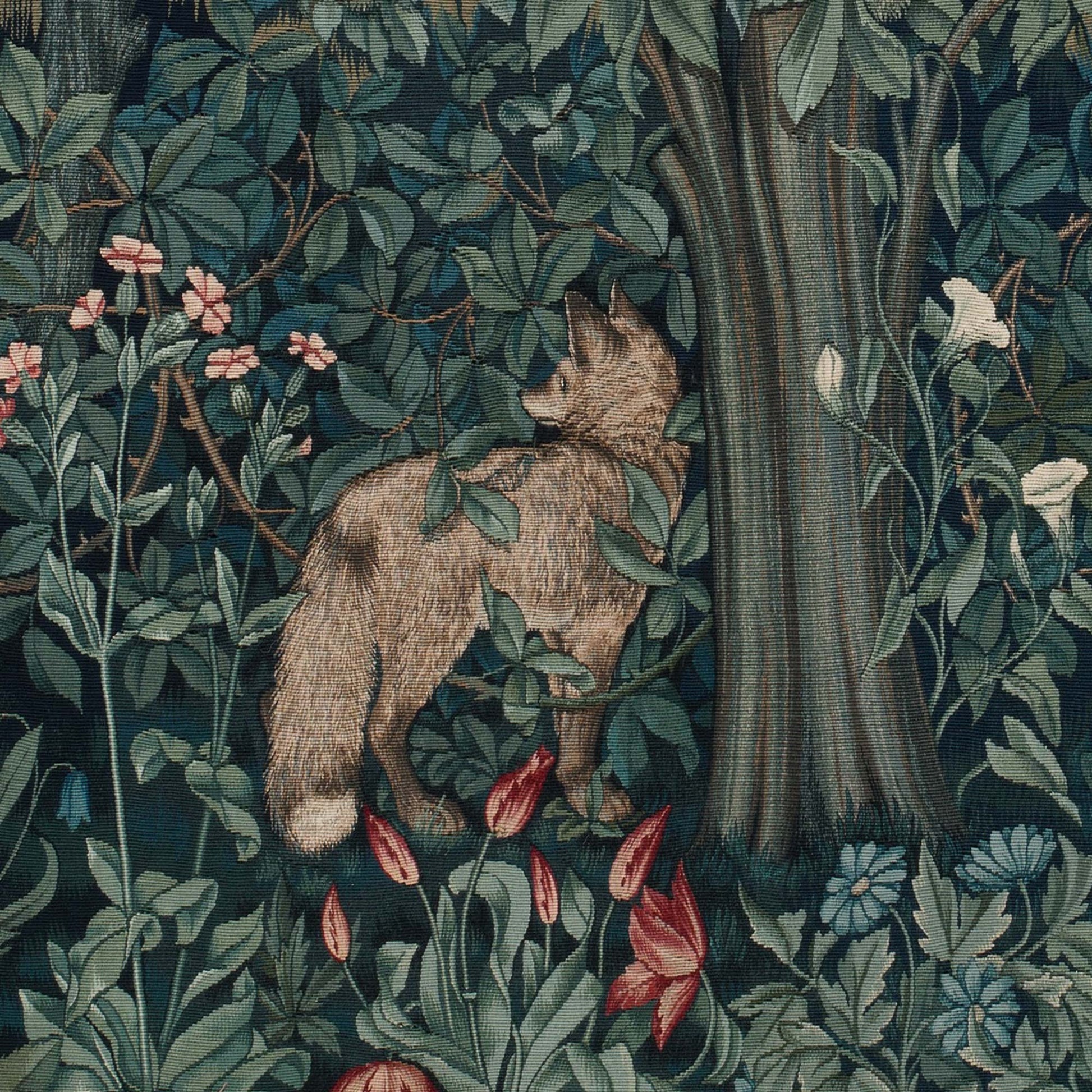 Detail of a red fox standing among trees and red tulips from the William Morris Greenery woodland tapestry.